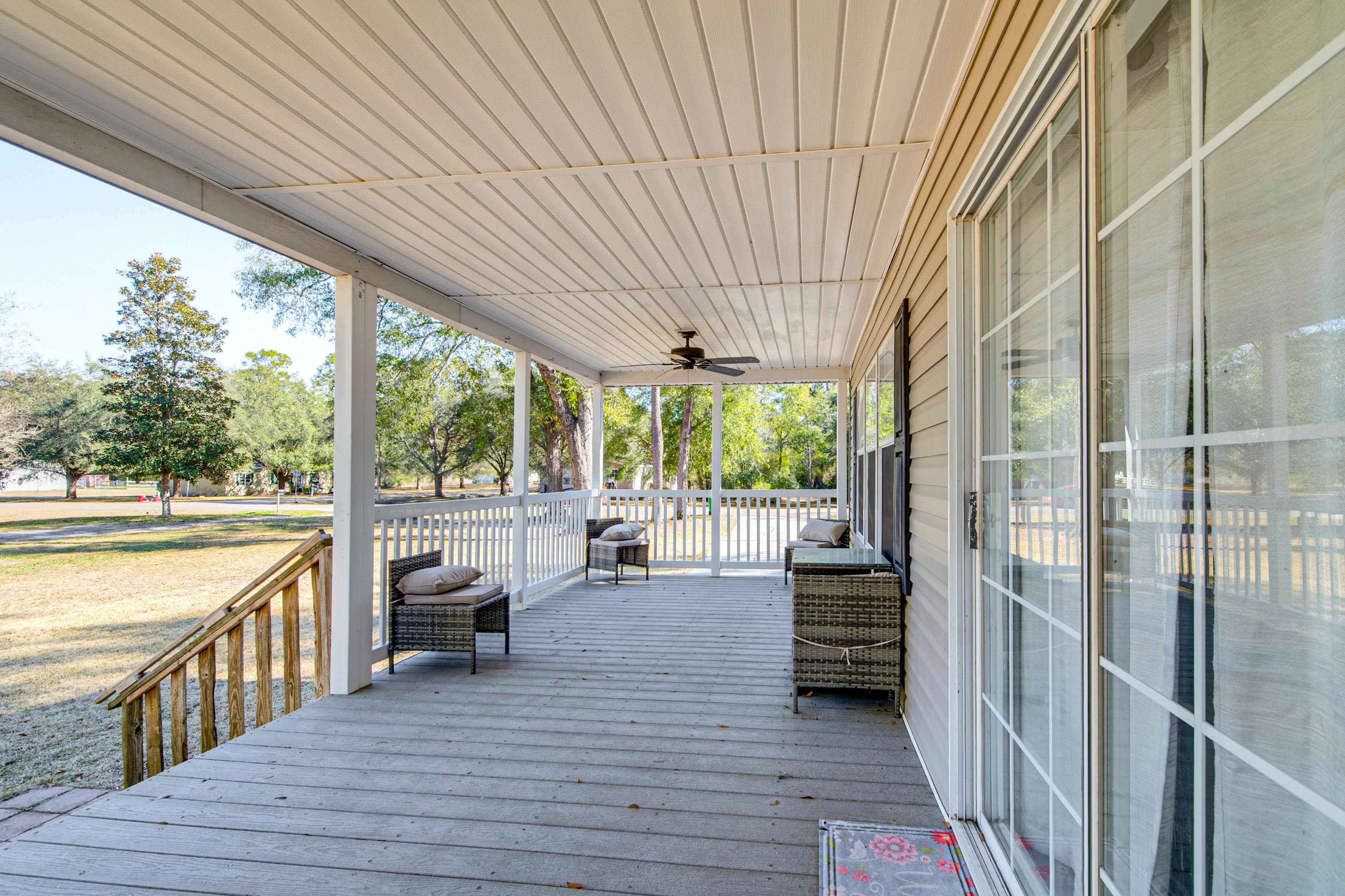 House Exterior | Covered Front Porch w/ Dining Areas & Seating