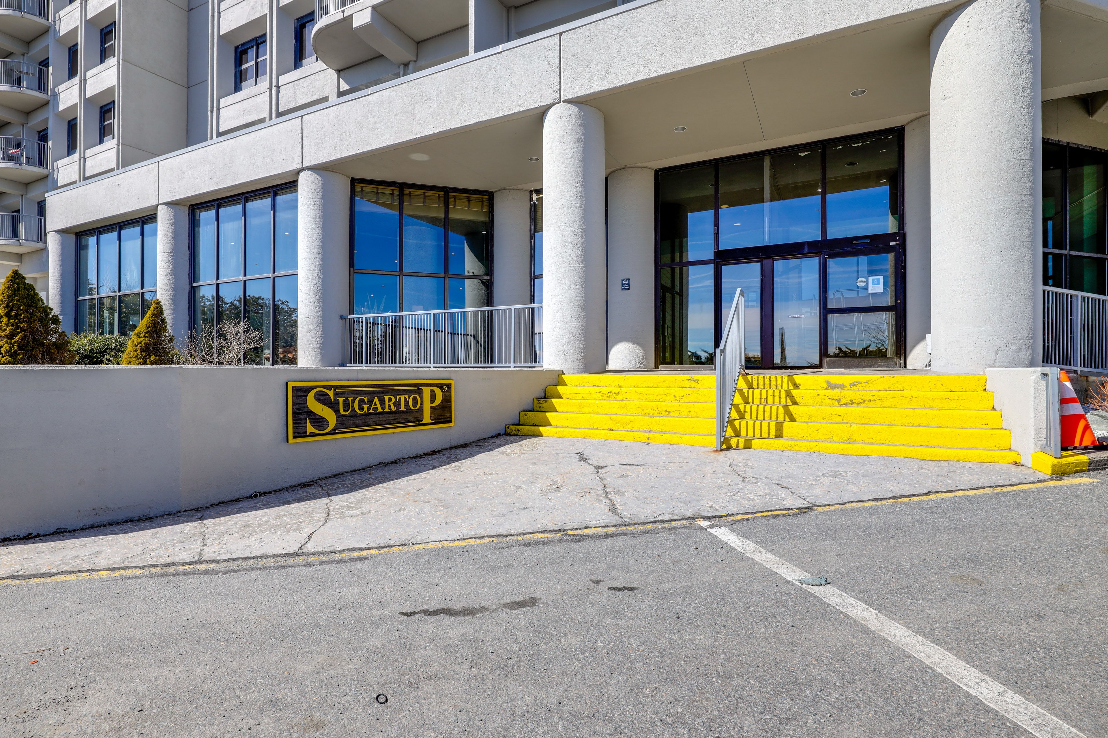 Building Exterior | Parking | Assigned Parking in Community Lot (2 Vehicles)