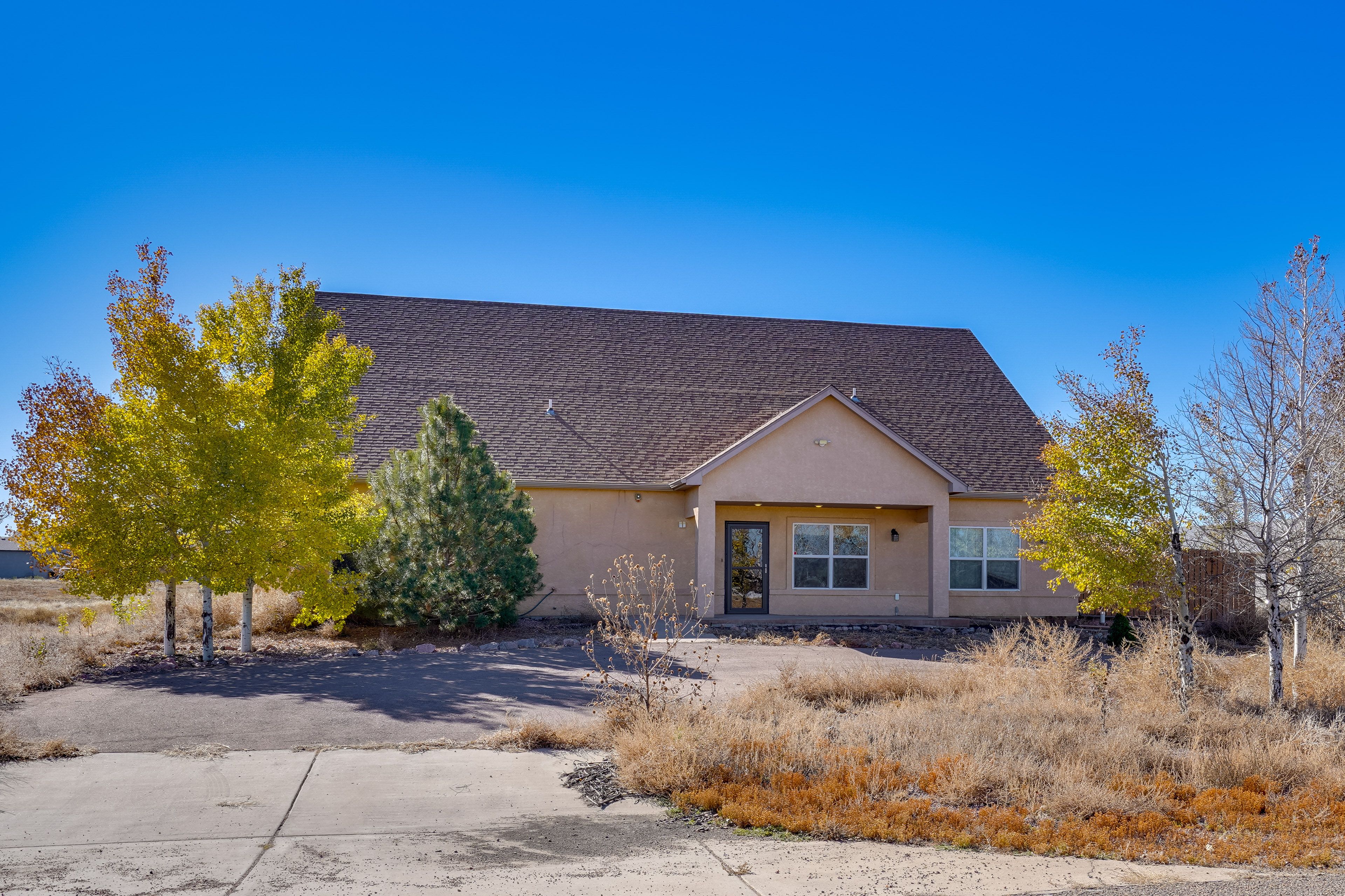 Property Exterior | Driveway (5 Vehicles) | Addt'l Parking in Rear | EV Charger