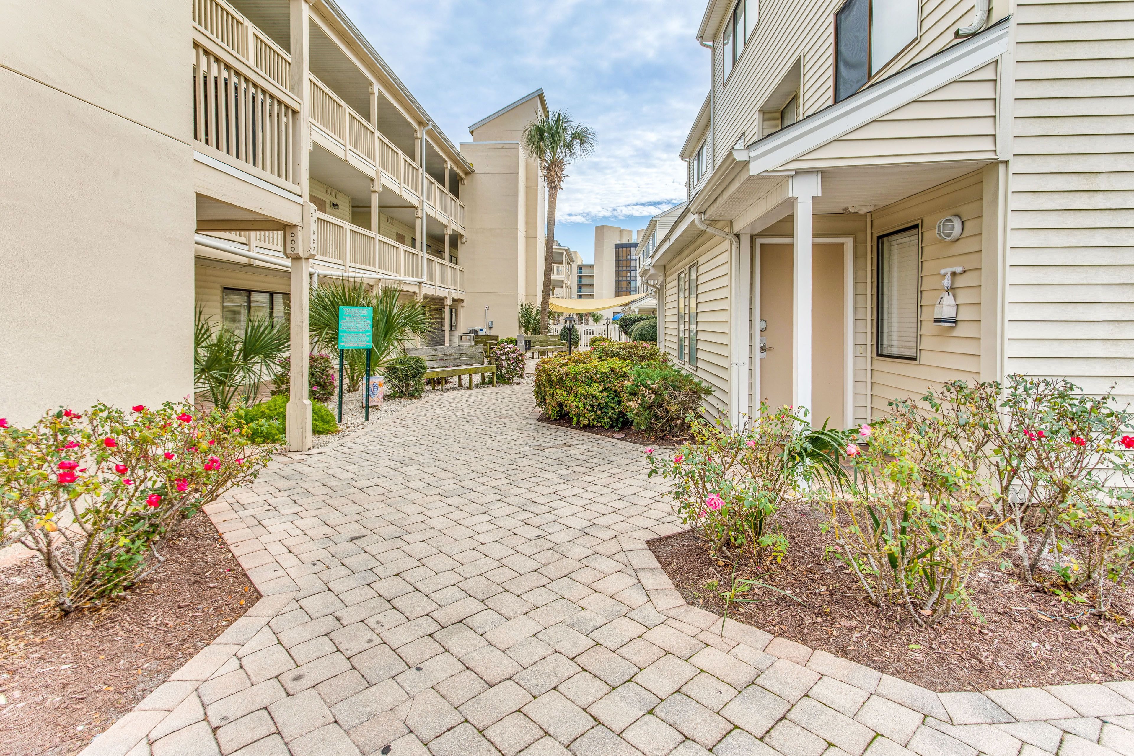 Townhouse Exterior | Community Garage (2 Vehicles)