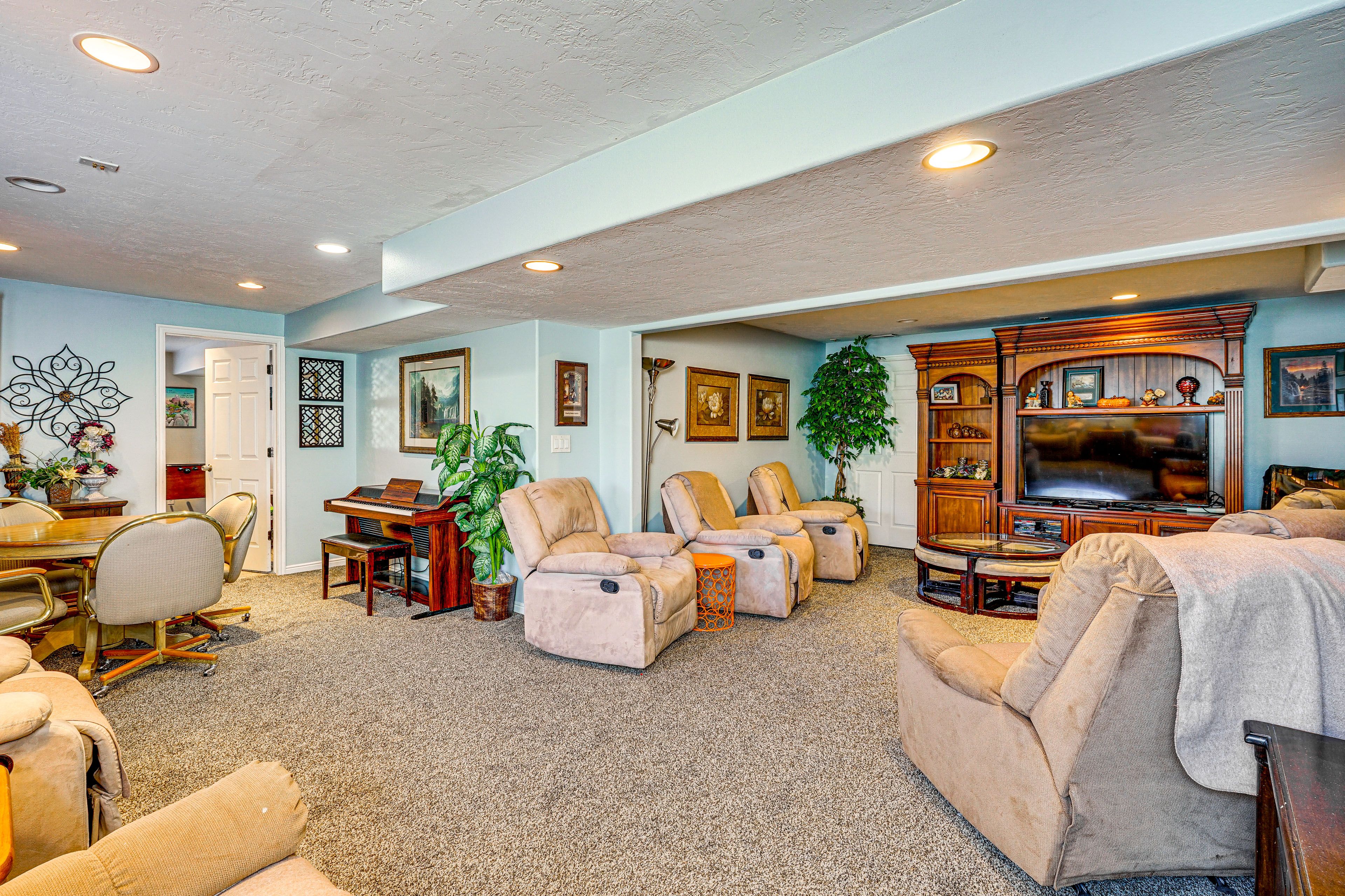 Additional Living Area | Basement | Fireplace | Card Table | Piano