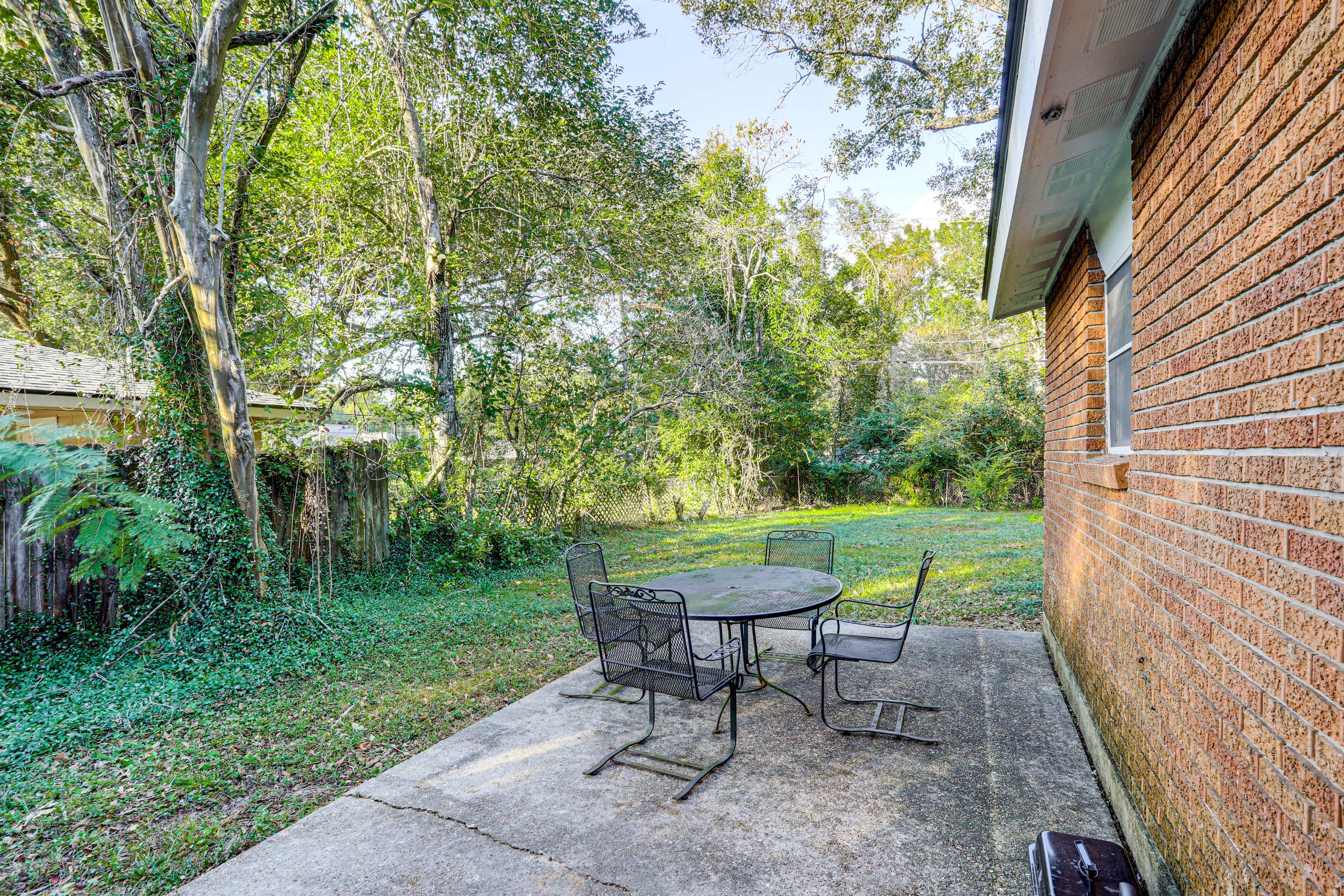 Partially Fenced Yard | Patio w/ Dining Set