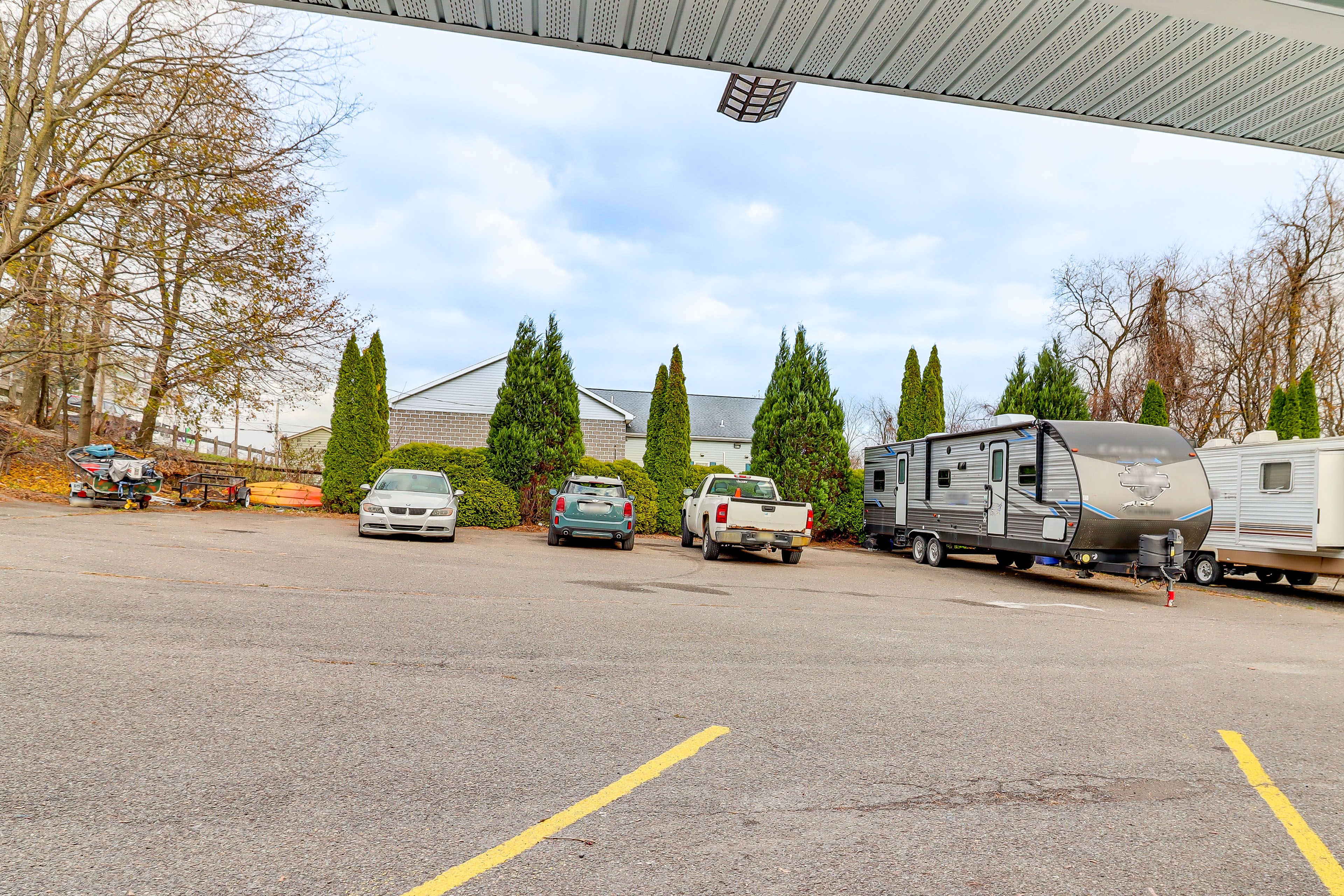 Parking | Assigned Spaces (2 Vehicles) | Open Lot (First-Come, First-Served)