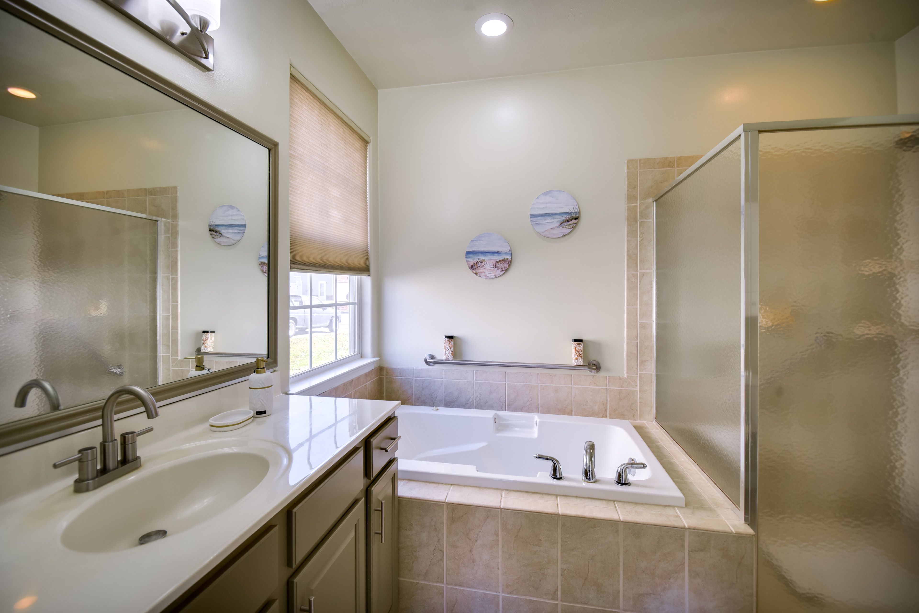 En-Suite Bathroom | Jetted Tub | Shower w/ Grab Rails | 1st Floor