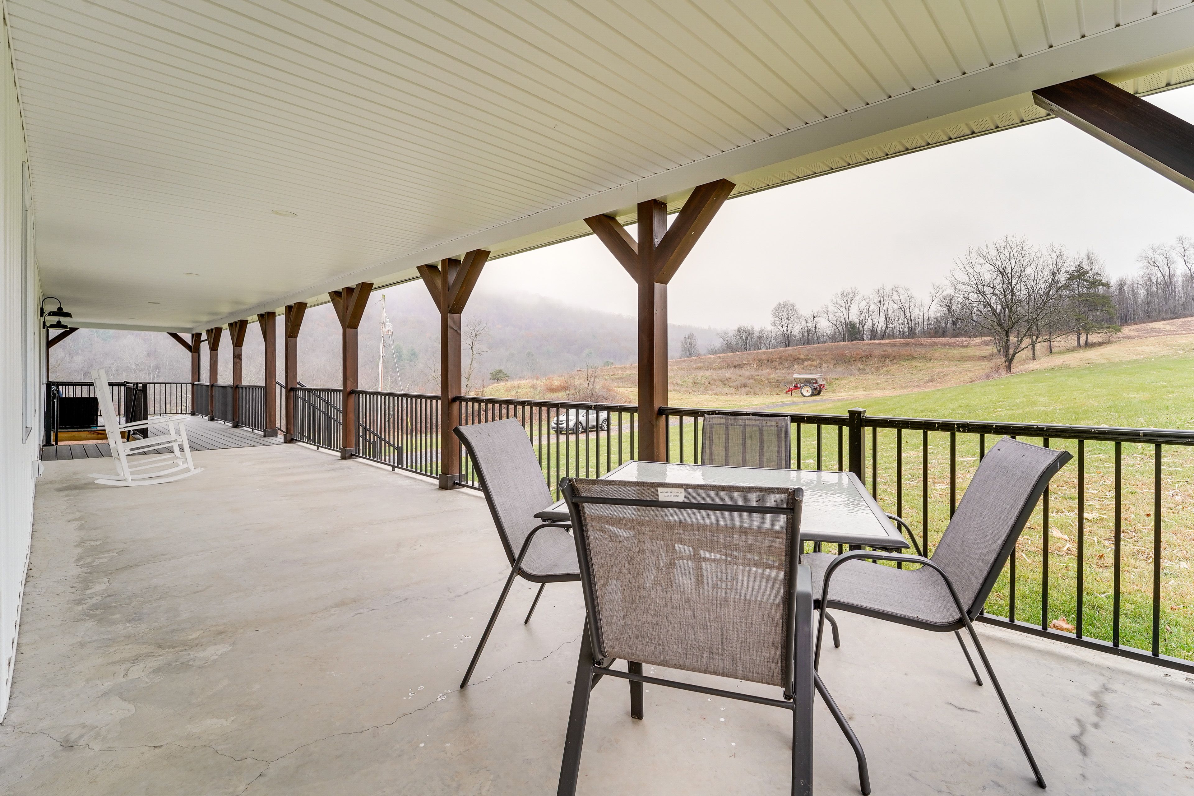 Covered Deck | Mountain & Country Views | Dining Area | Lounge Seating