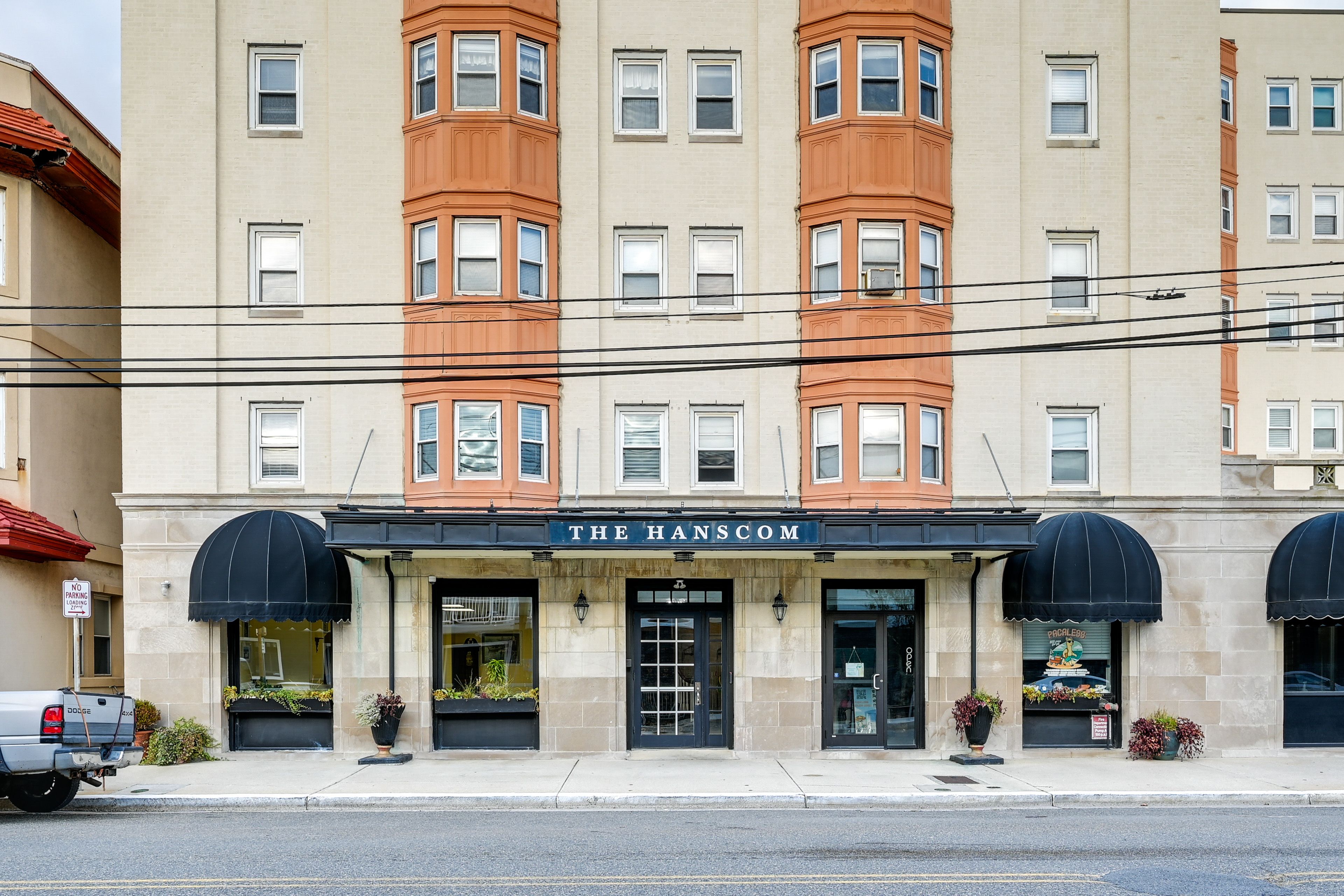 Building Exterior | Free Street Parking | Paid Public Lots