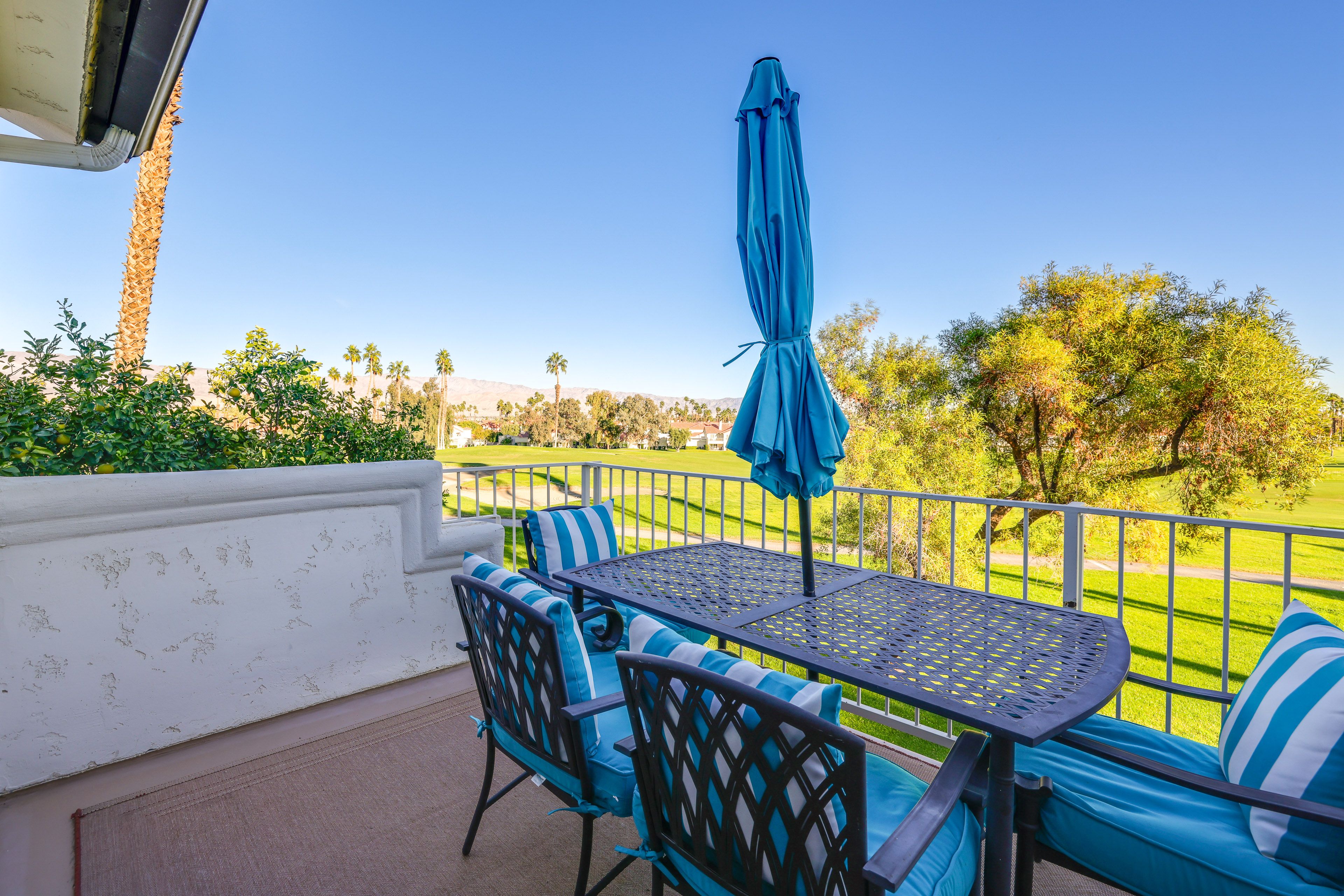 Balcony | Golf Course & Mountain Views | Gas Grill