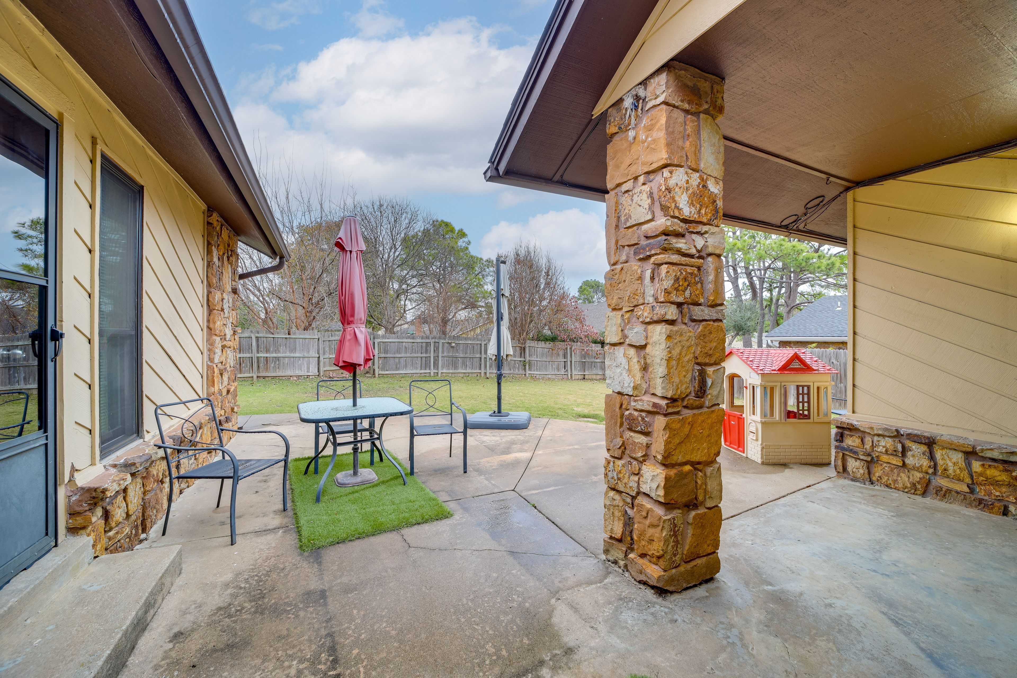 House Exterior | Furnished Patio | Dining Area w/ Umbrella