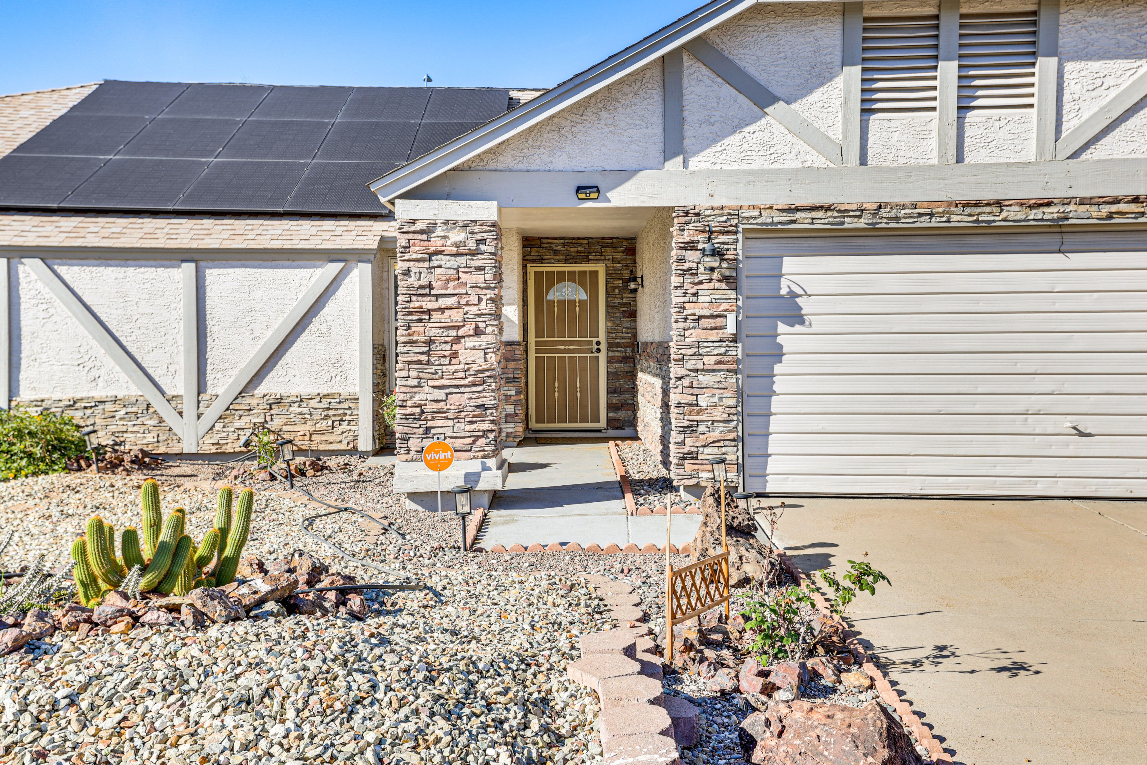 Property Exterior | Outdoor Kitchen | Covered Patio w/ Dining Tables