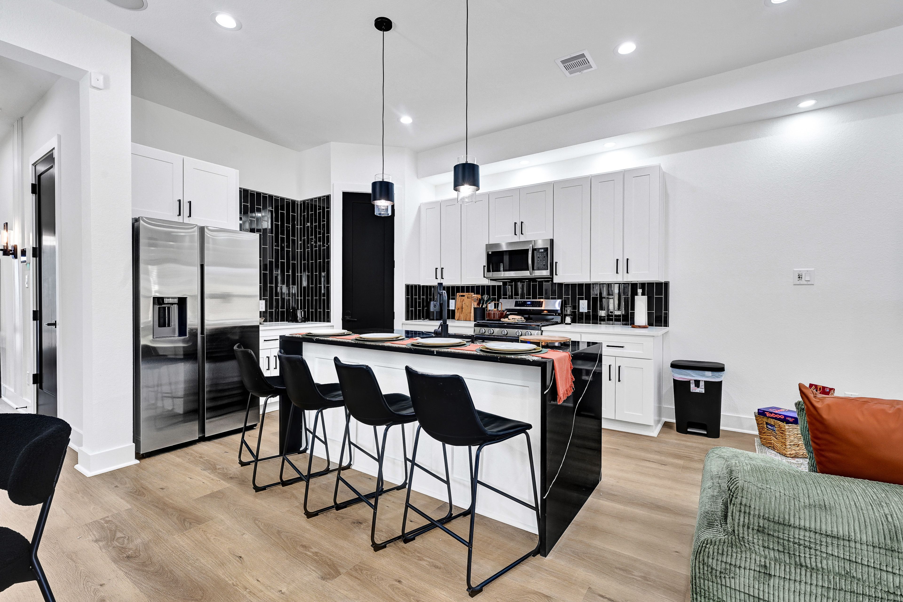Dining Area & Breakfast Bar | 1st Floor | Dishware/Flatware
