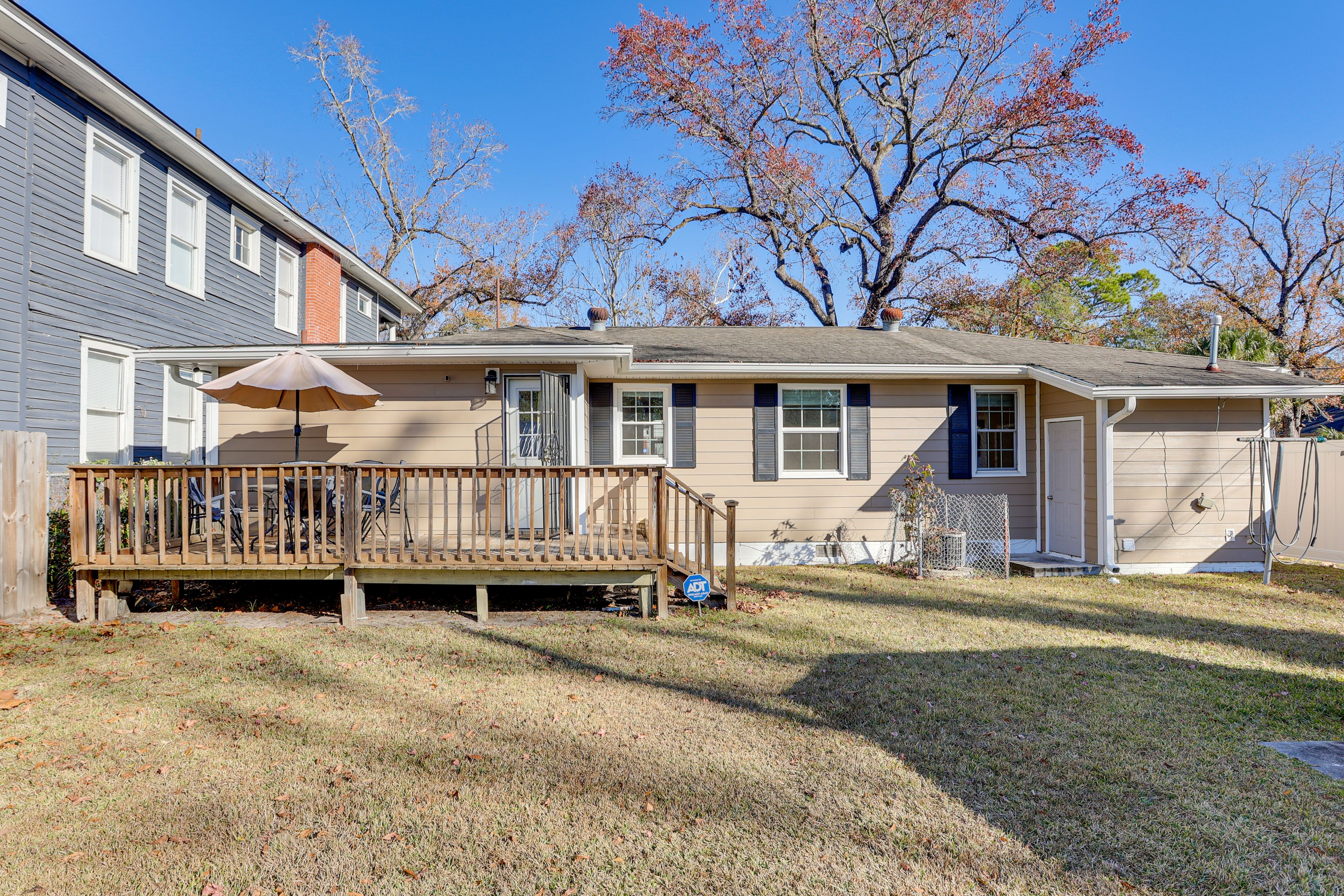 Back Exterior | Fenced-In Yard | Deck w/ Dining Area