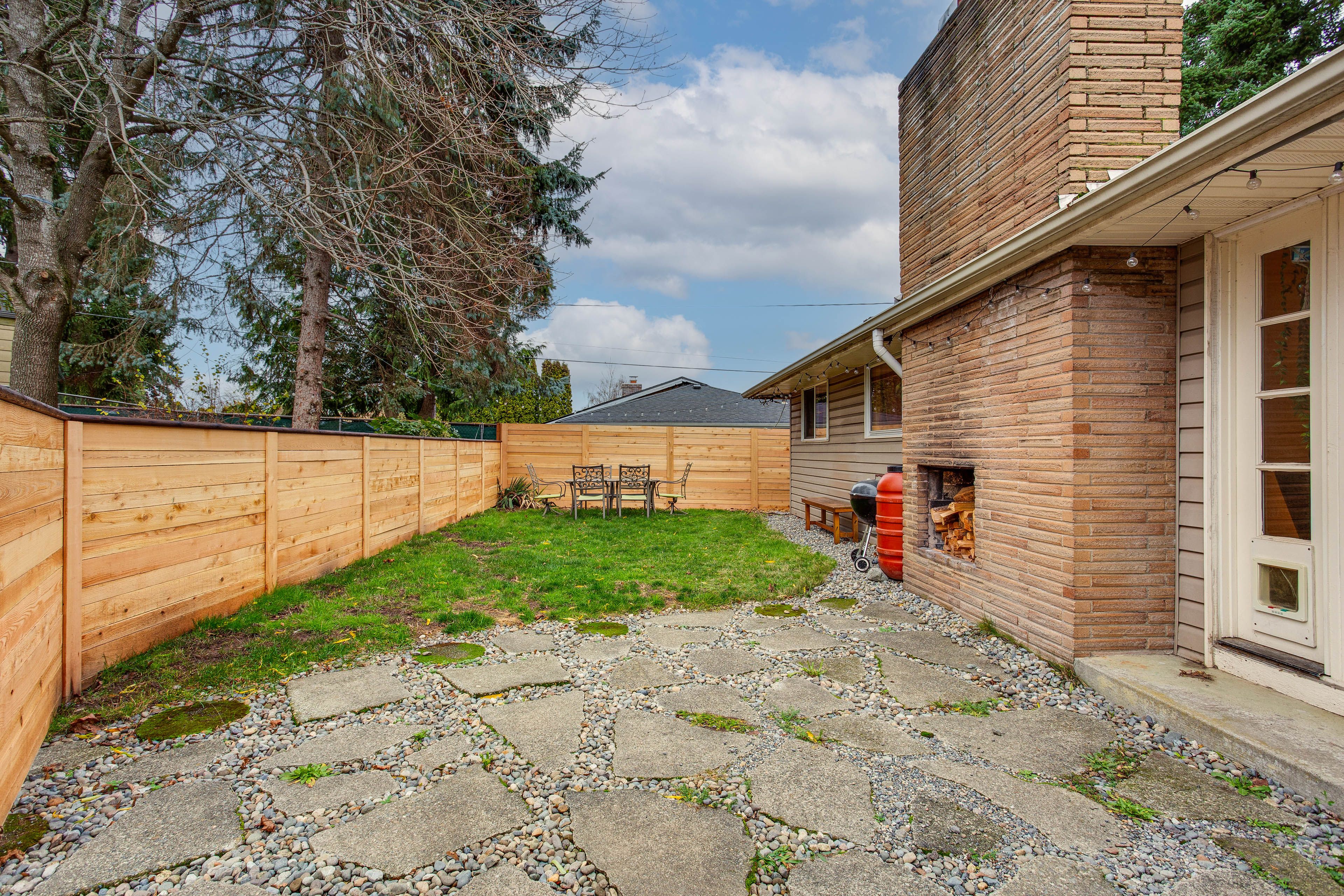 House Exterior | Fenced Backyard | Dining Area | Gas & Charcoal Grills