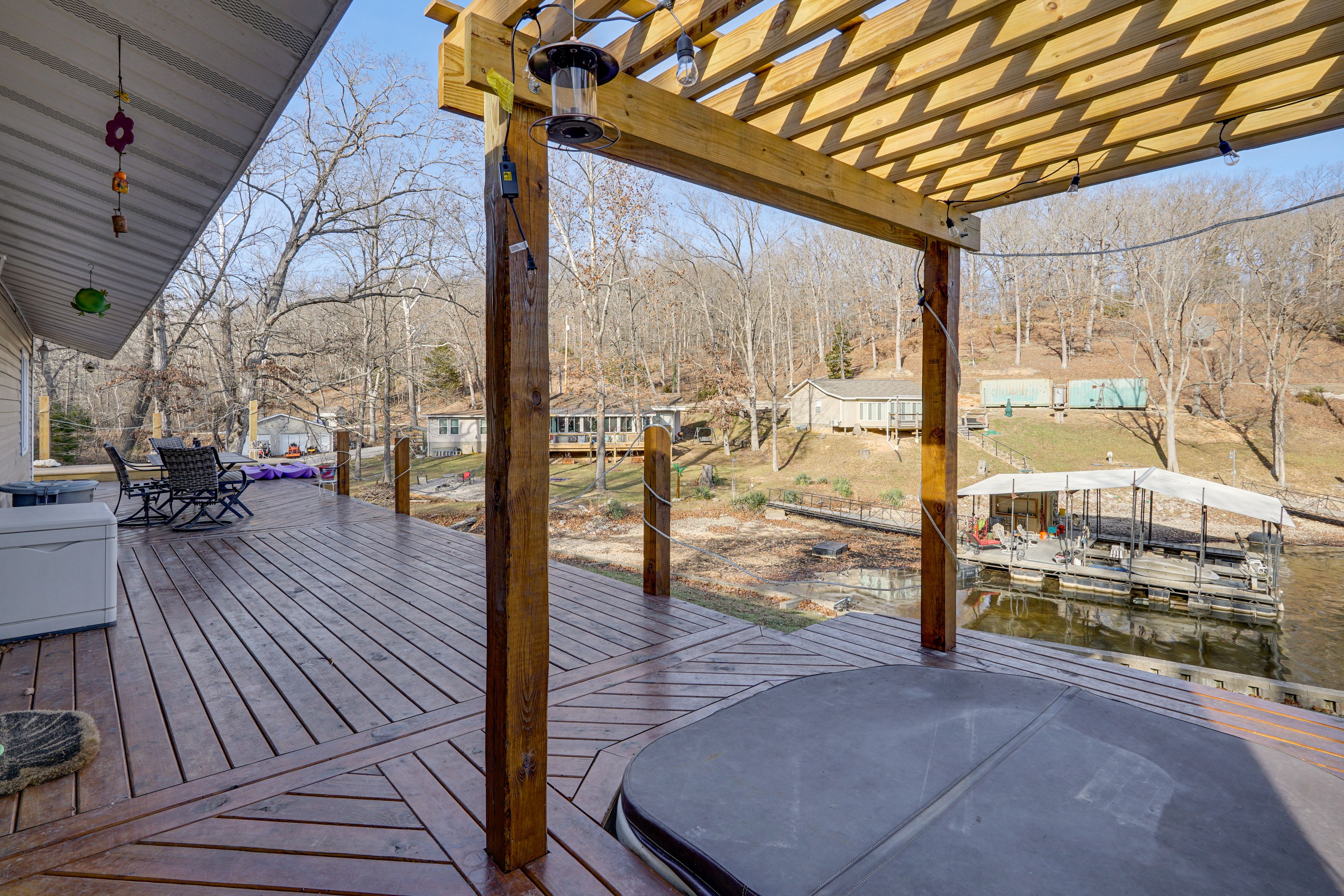 House Exterior | Wraparound Deck | Pergola w/ Hot Tub | Lake Views & Access