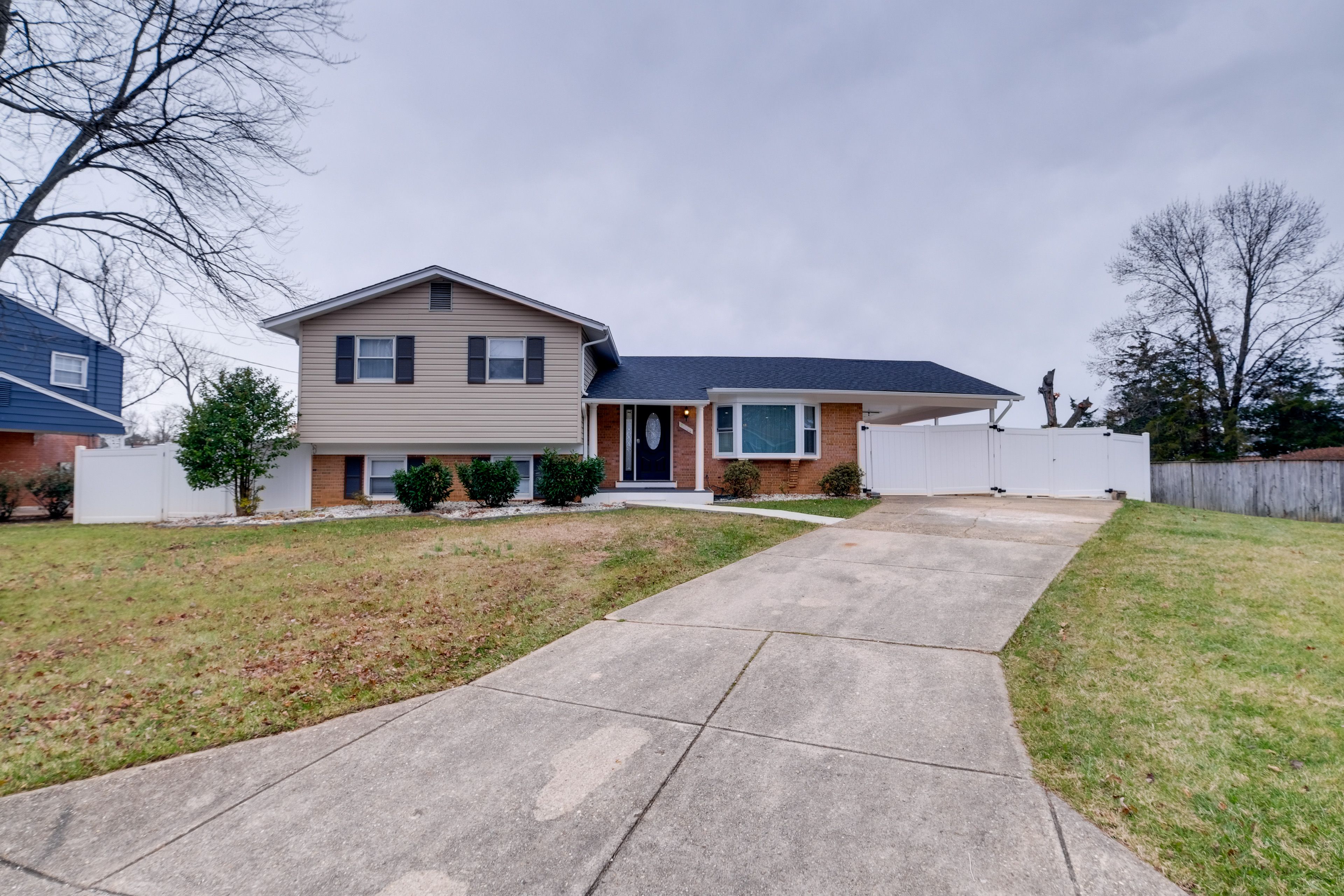 Duplex Exterior | Deck | Partially Fenced Backyard