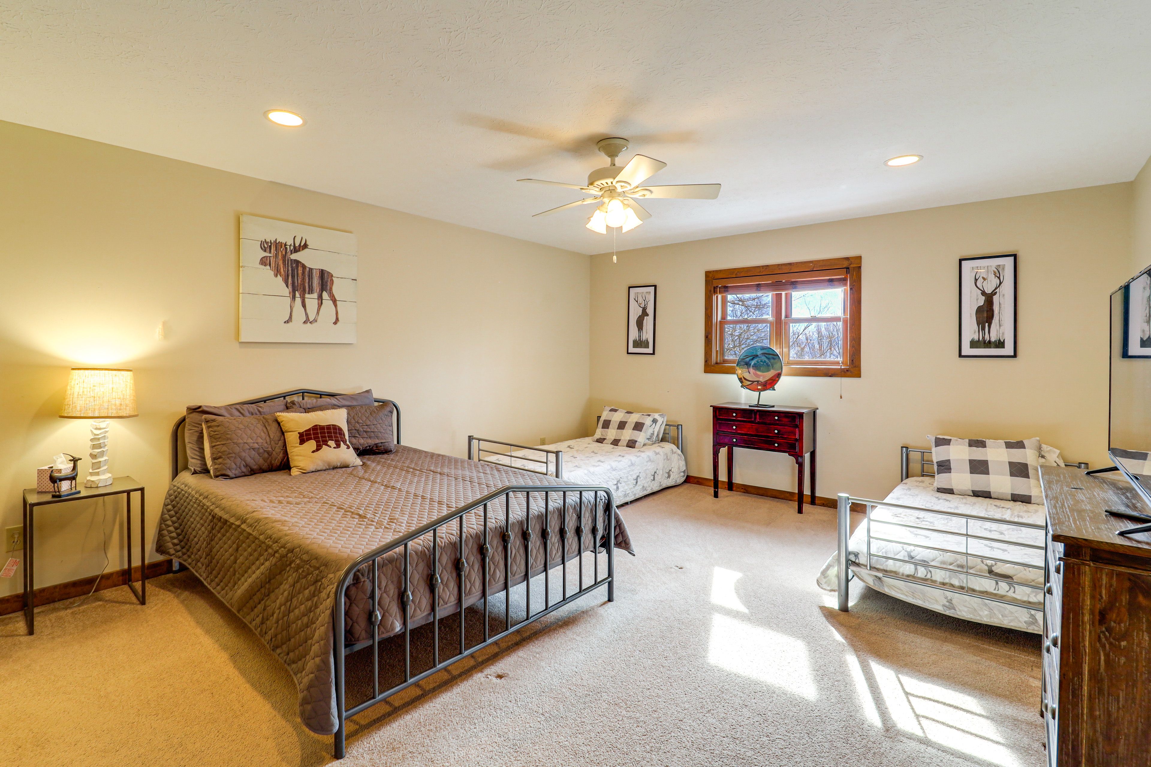 Bedroom 1 | Queen Bed | 2 Twin Beds | Linens Provided | Main Floor