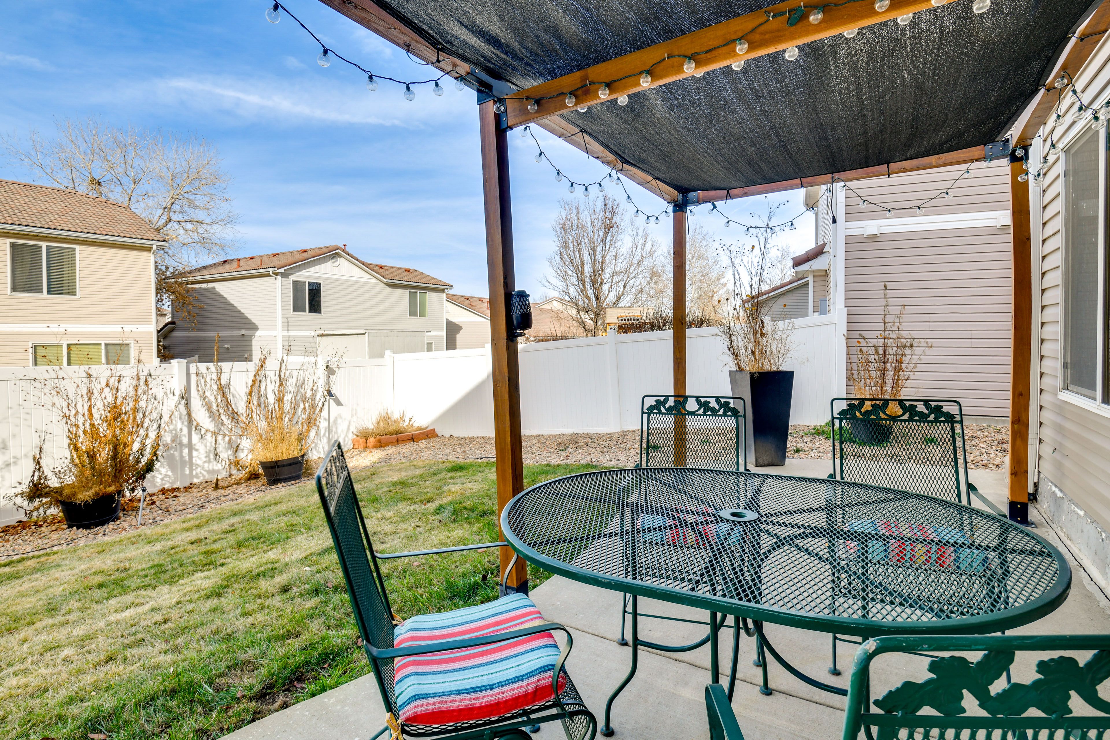 House Exterior | Covered Patio w/ Dining Area | Fenced Backyard