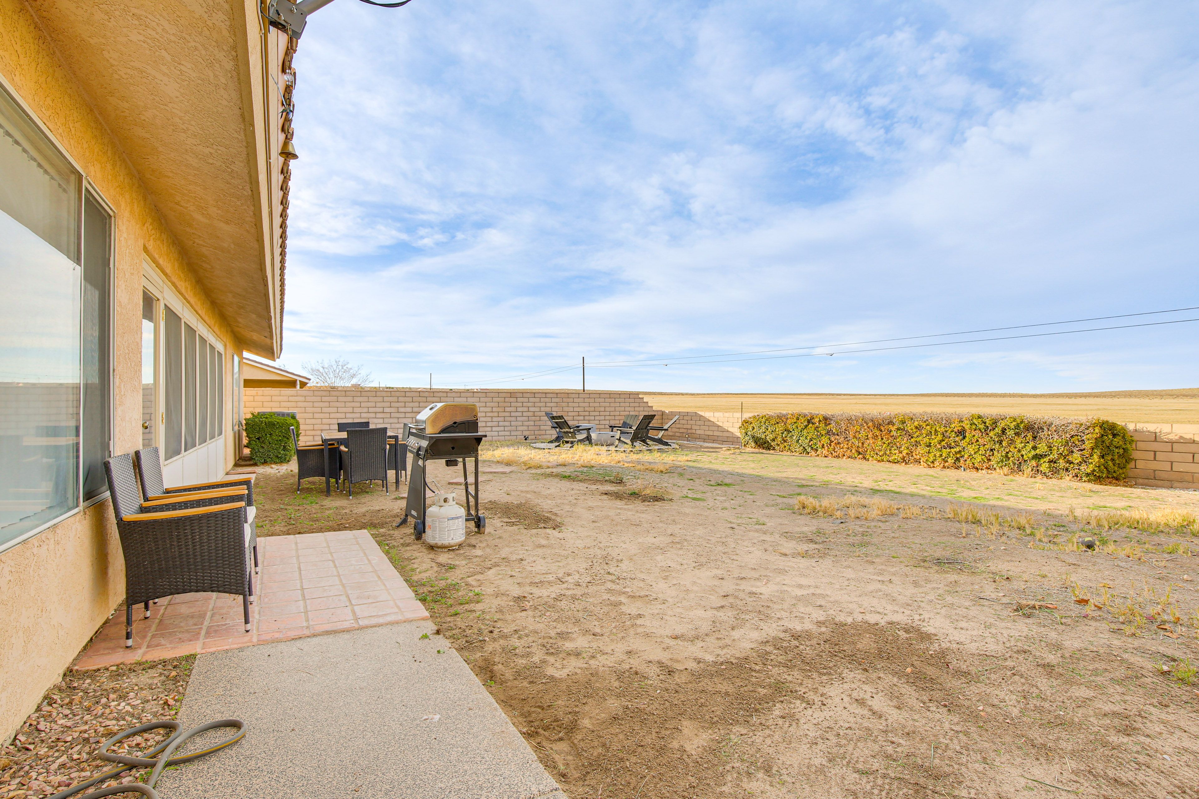 House Exterior | Patio w/ Seating | Gas Grill | Dining Area