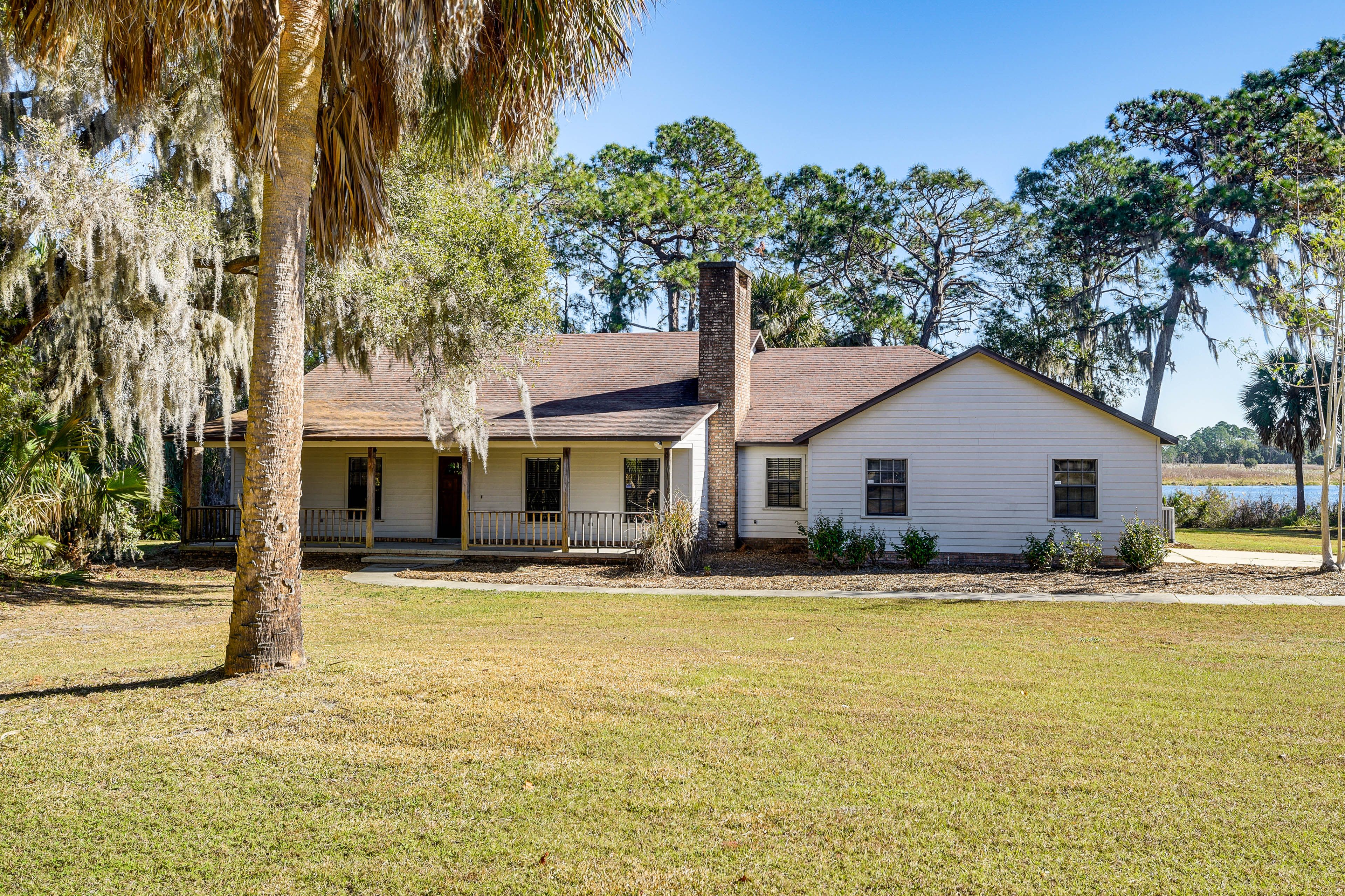 Property Exterior | Screened-In Porch