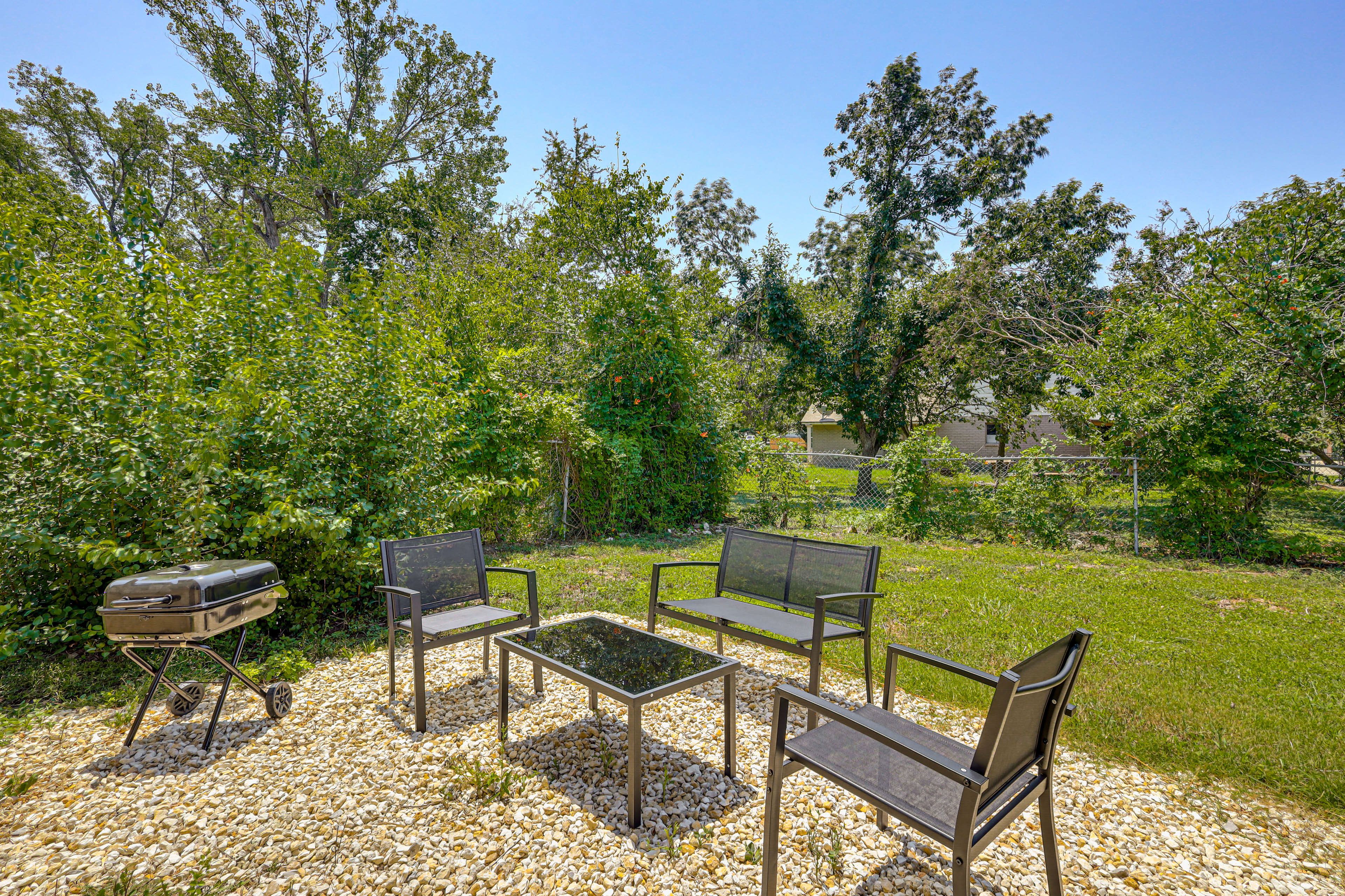 Gravel Patio | Charcoal Grill | Fenced Backyard
