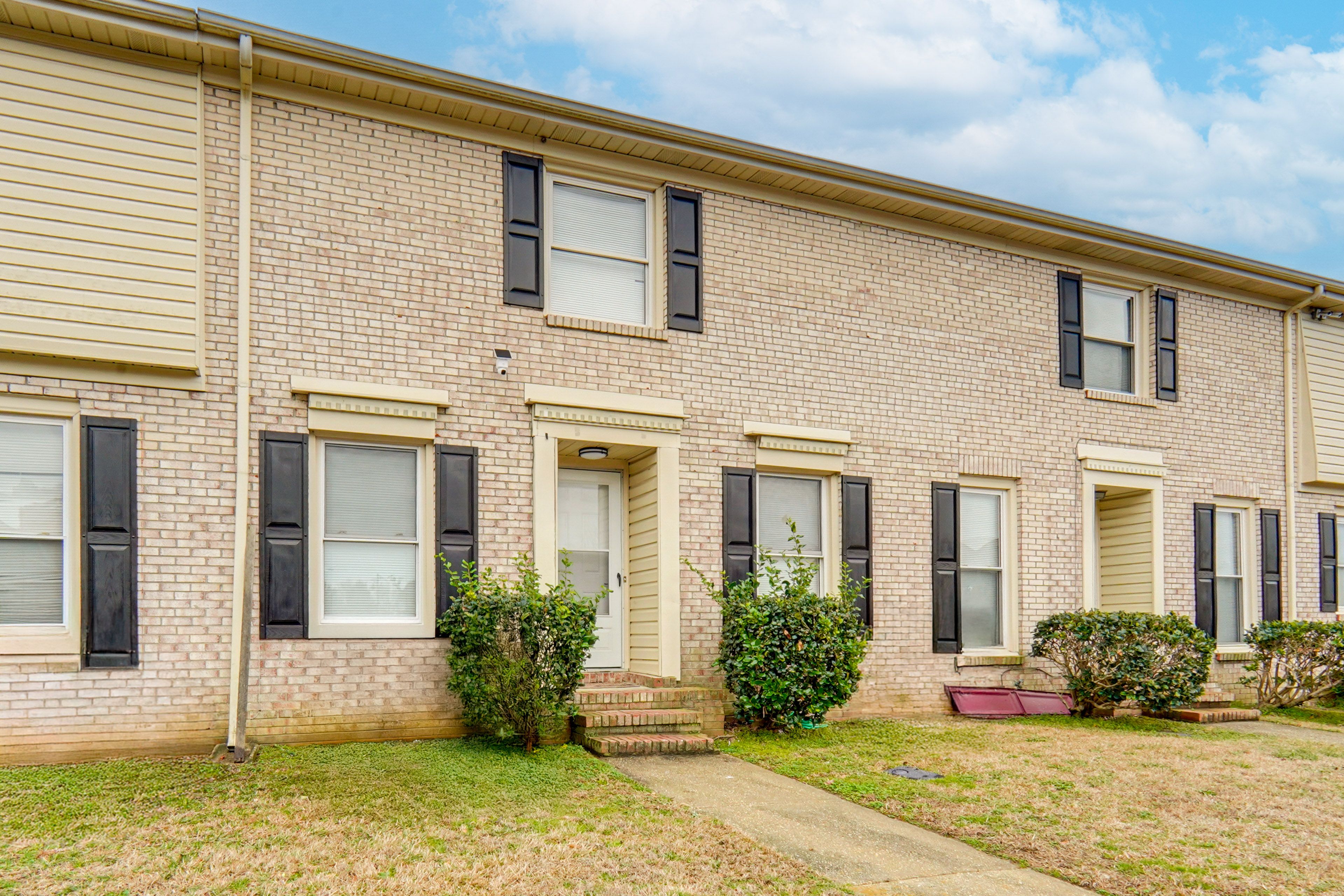 Townhome Exterior | Assigned Space (1 Vehicle) | Community Lot (1 Vehicle)