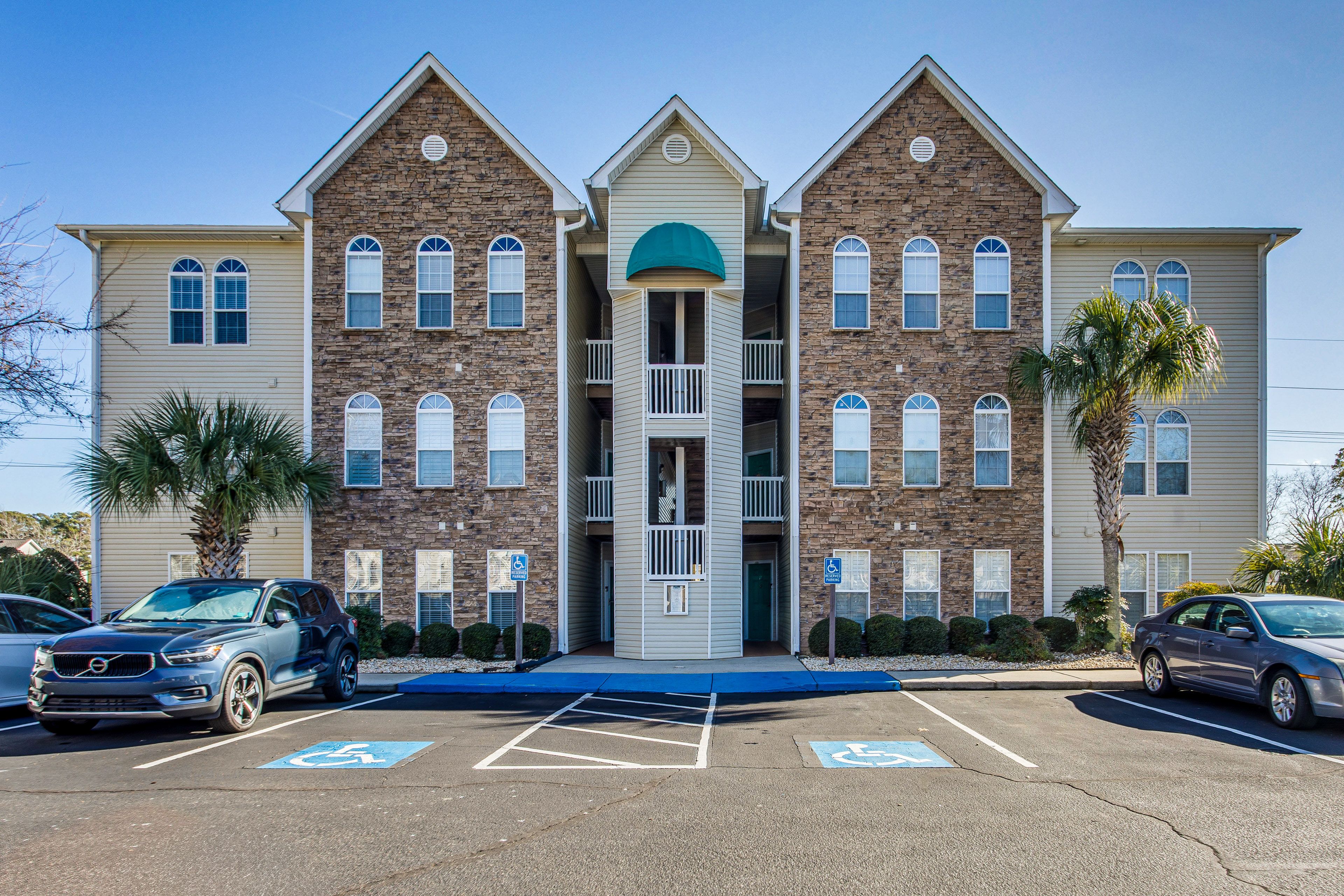 Property Exterior | Open Community Lot (4 Vehicles)