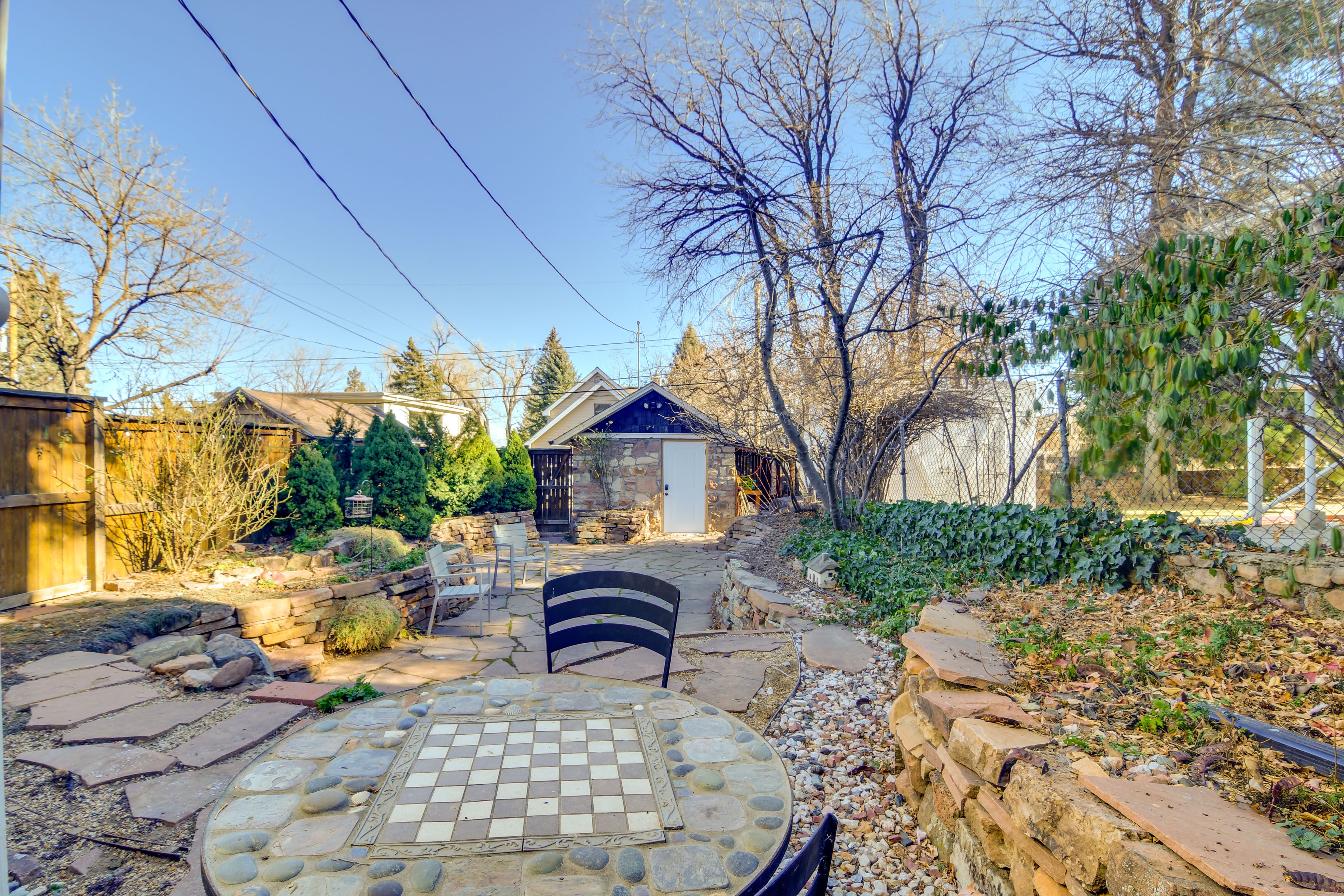 Studio Exterior | Patio w/ Dining Area | Addt'l Seating | Fenced Courtyard