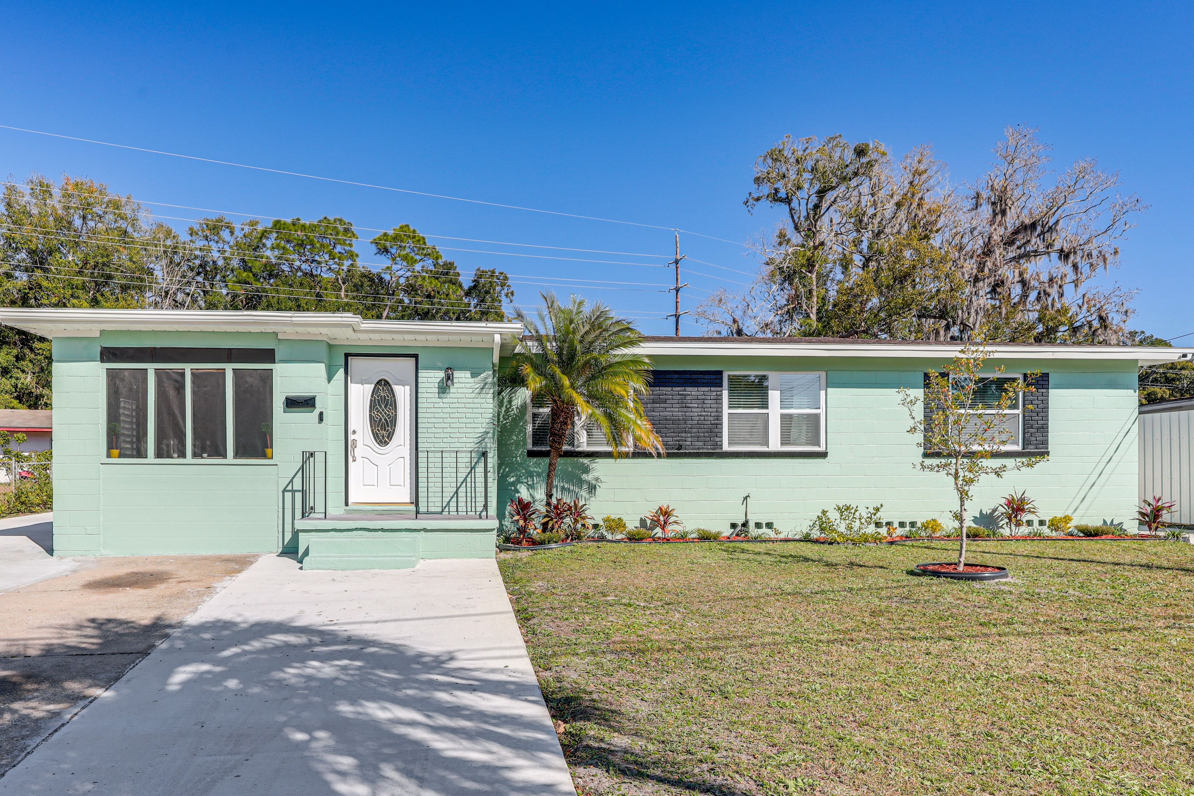 Property Exterior | Screened-In Patio | Wood-Burning Fire Pit | Charcoal Grill