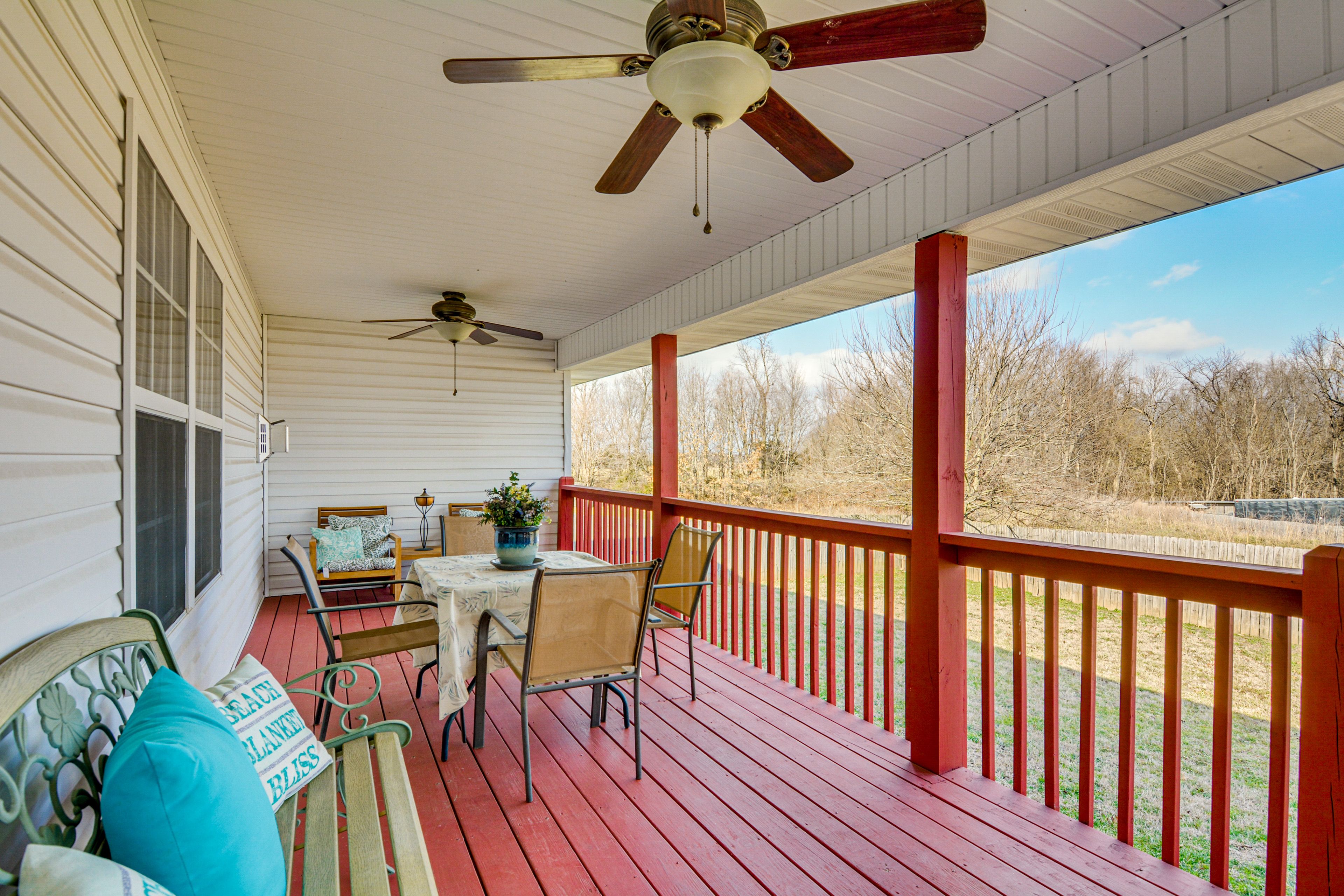 House Exterior | Covered Deck w/ Seating | Dining Area