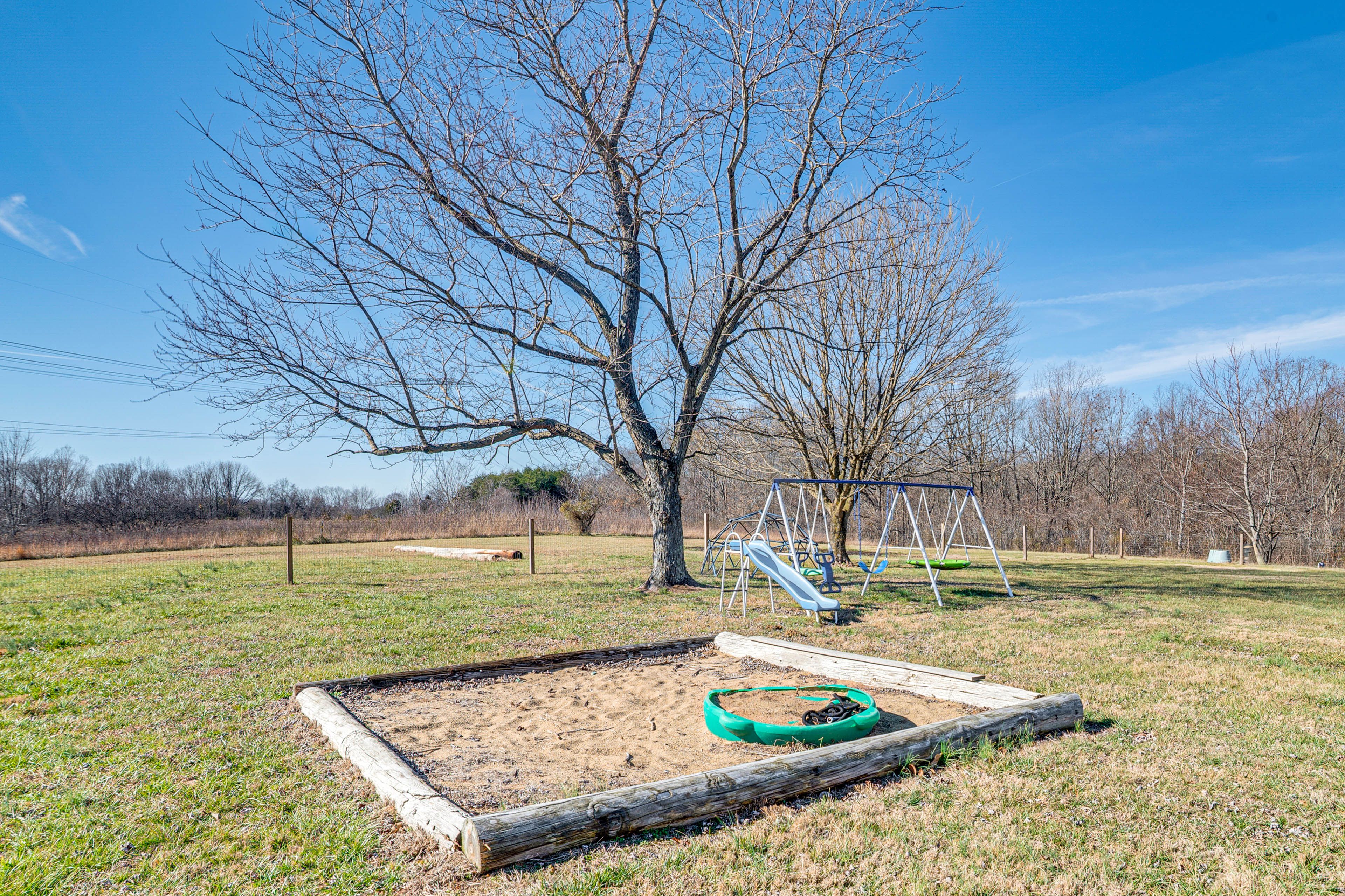 House Exterior | Spacious Yard | Kids' Sandbox & Swing Set