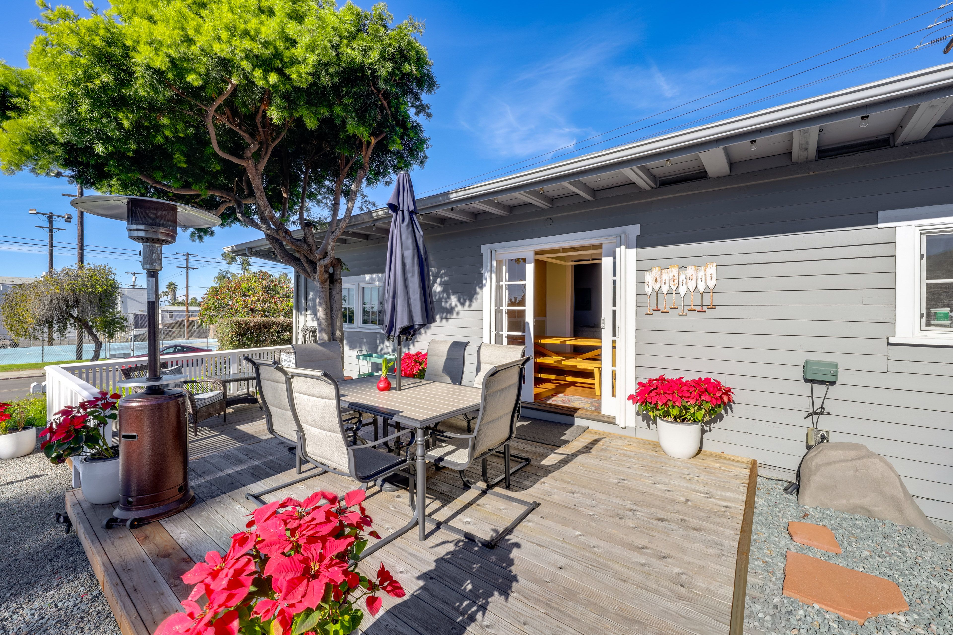 House Exterior | Furnished Deck | Dining Area w/ Umbrella