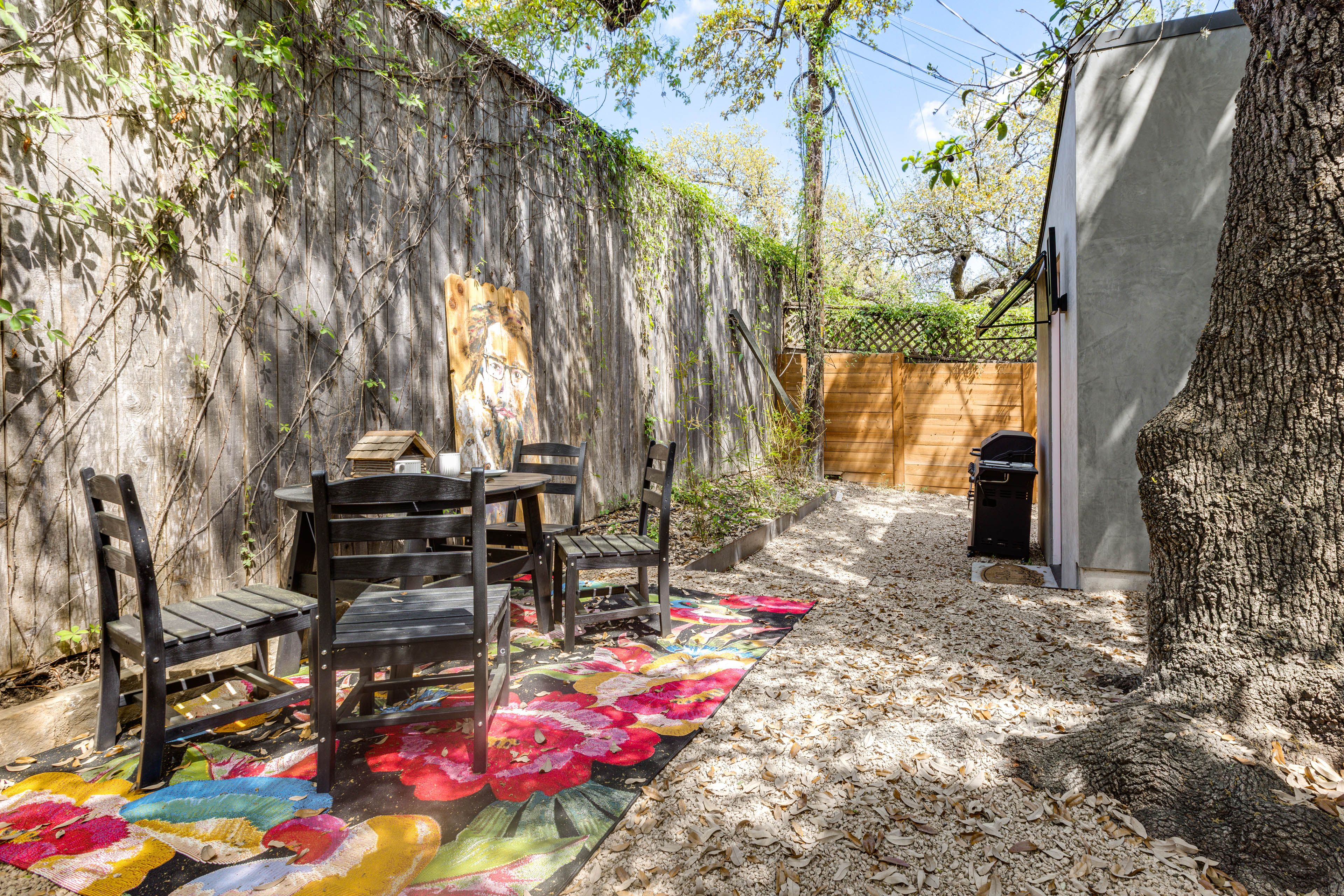Fenced Gravel Area w/ Dining Table | Gas Grill