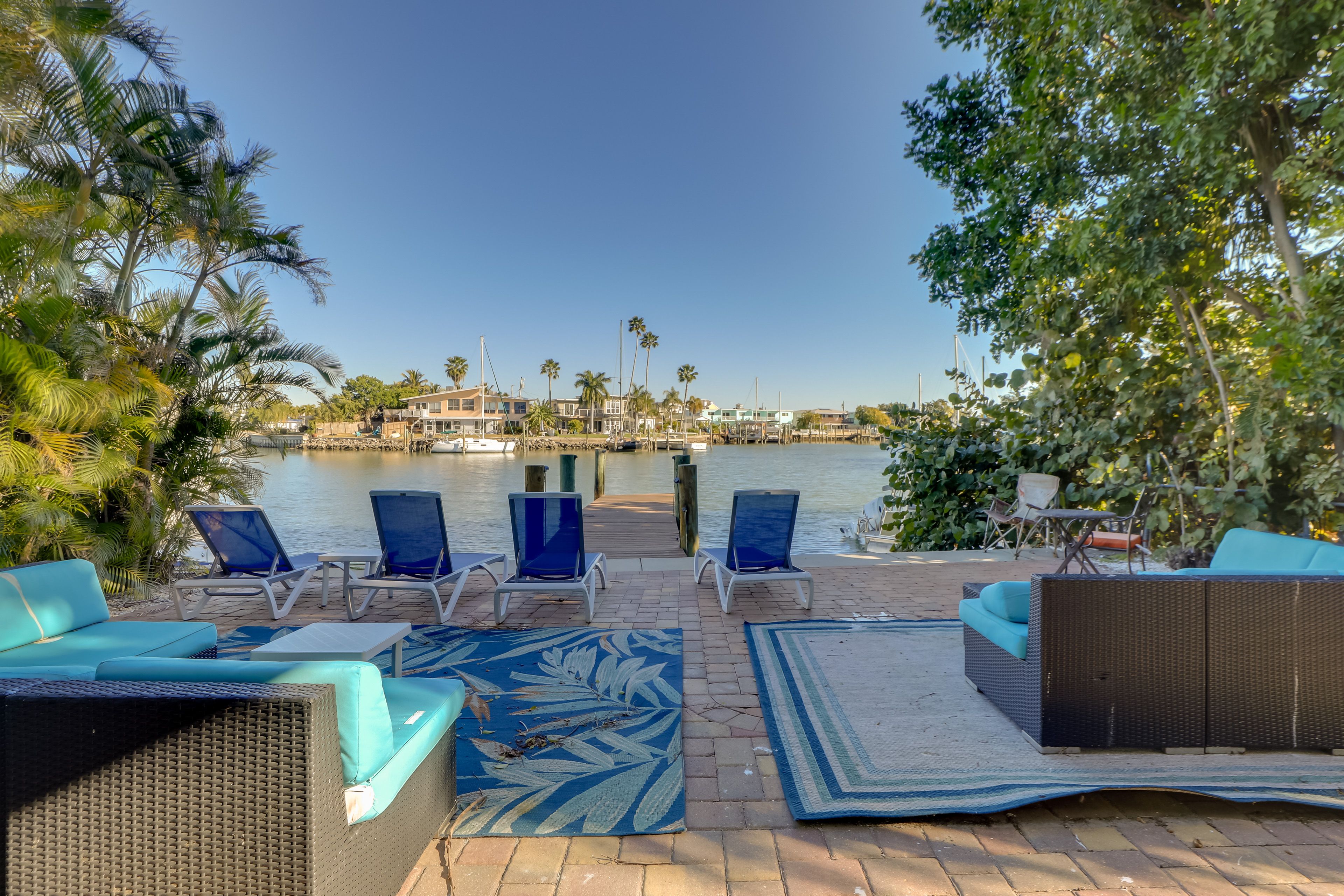 Shared Patio & Dock | Walking Distance to John's Pass Village