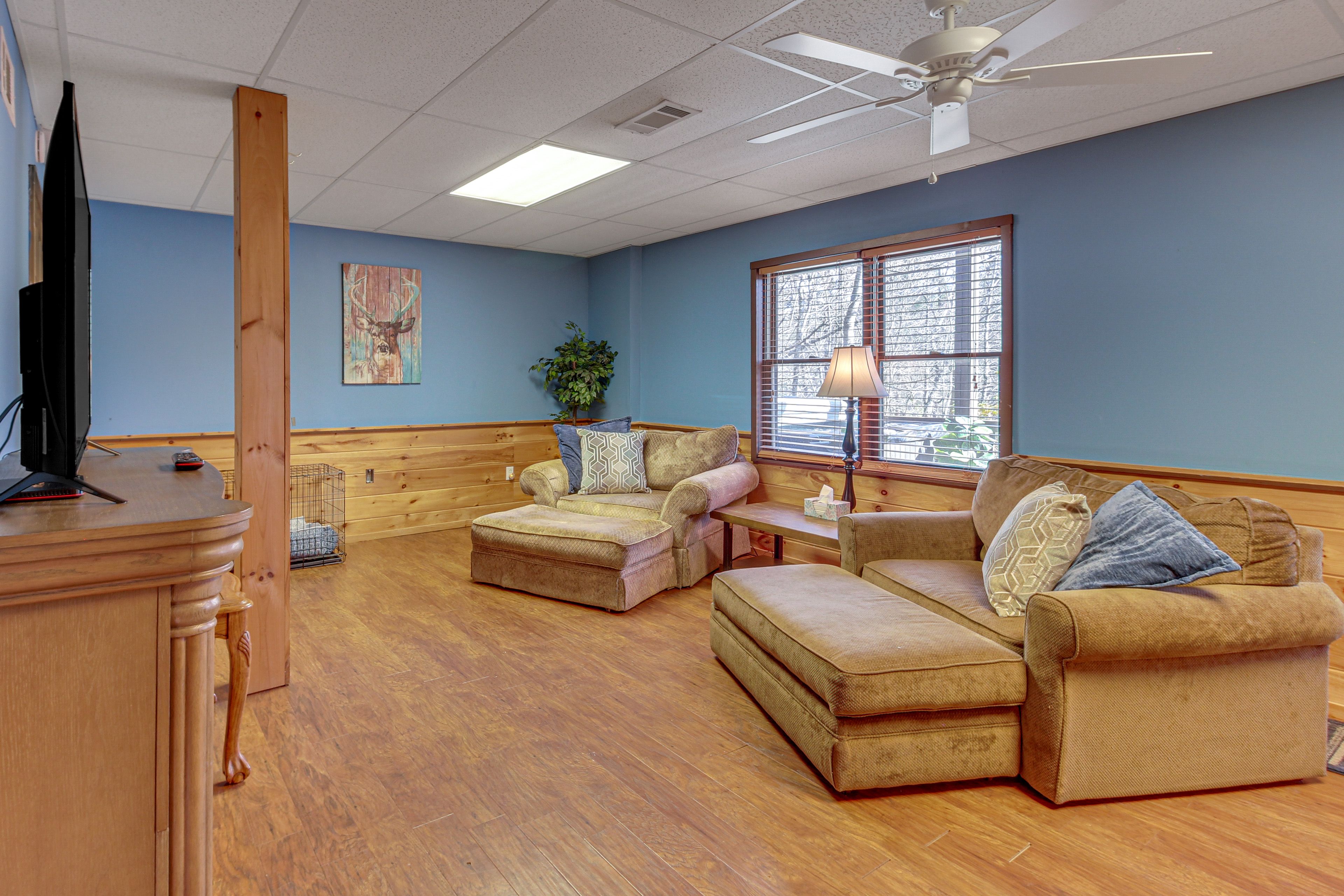 Family Room | Lower Level | Twin Sleeper Chair | Electric Fireplace | Dartboard