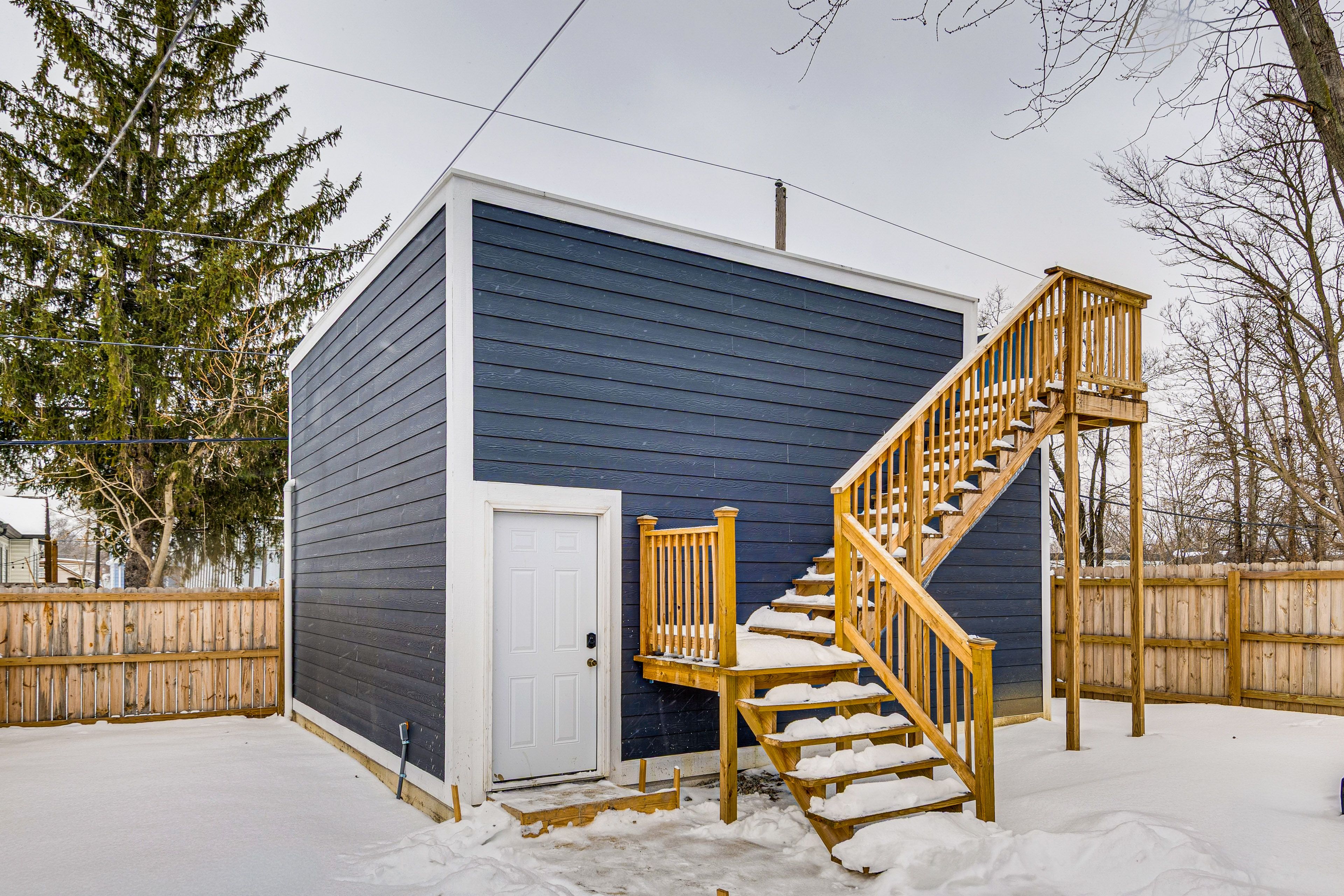 House Exterior | Furnished Rooftop Lounge