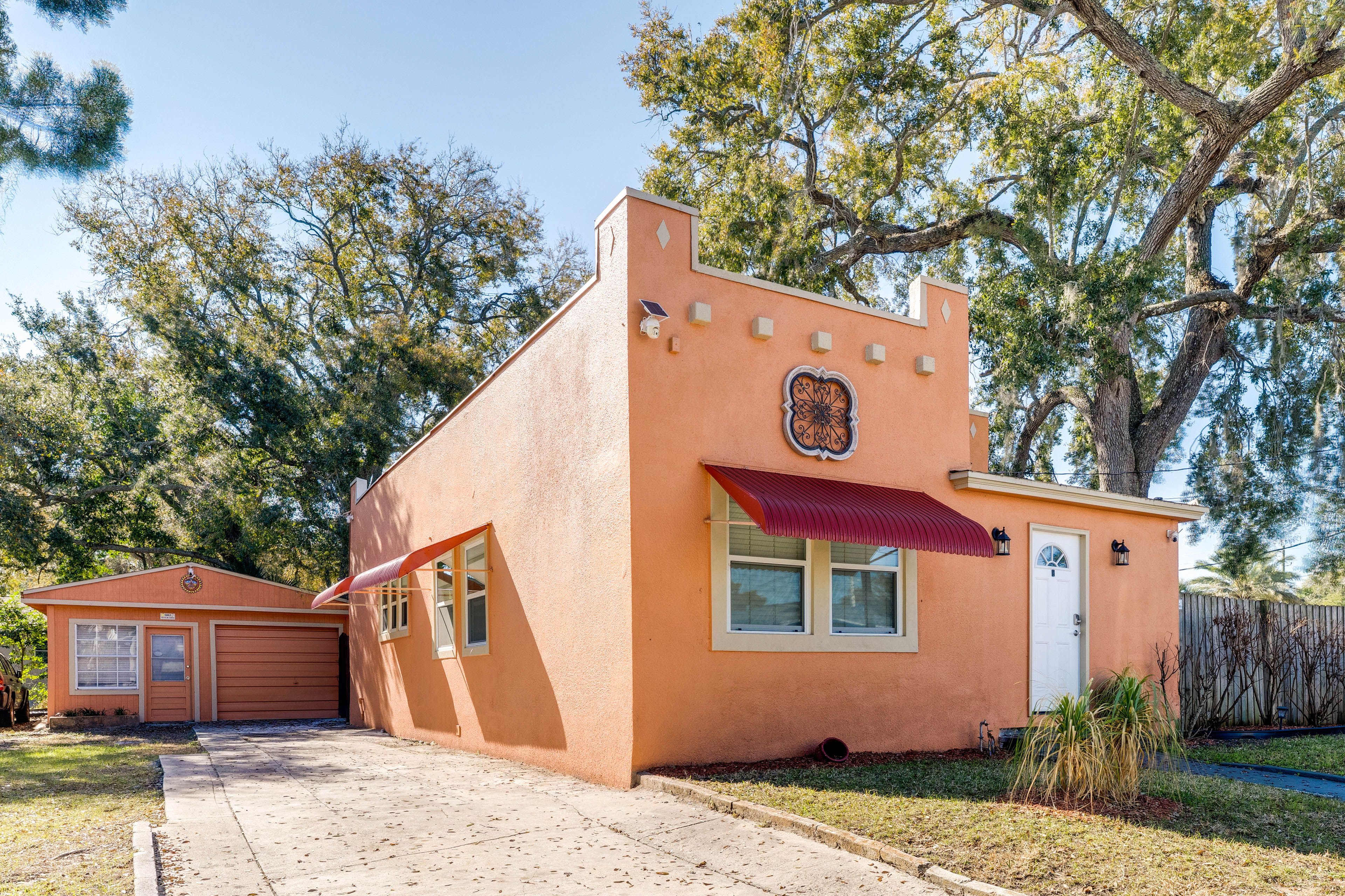 Property Exterior | Covered Deck | Fenced-In Yard