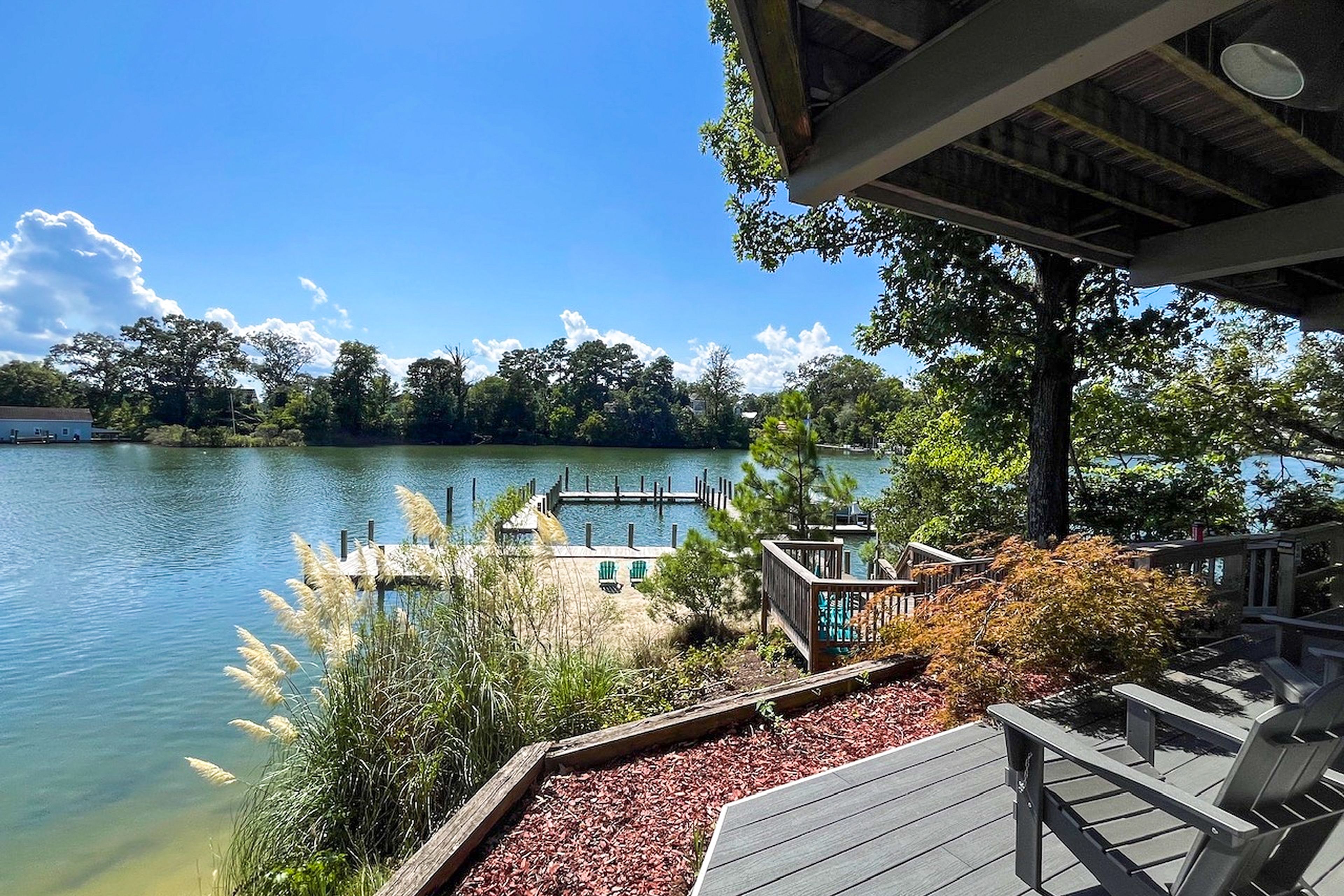 Expansive Balcony Waterfront with Beach and Dock Views