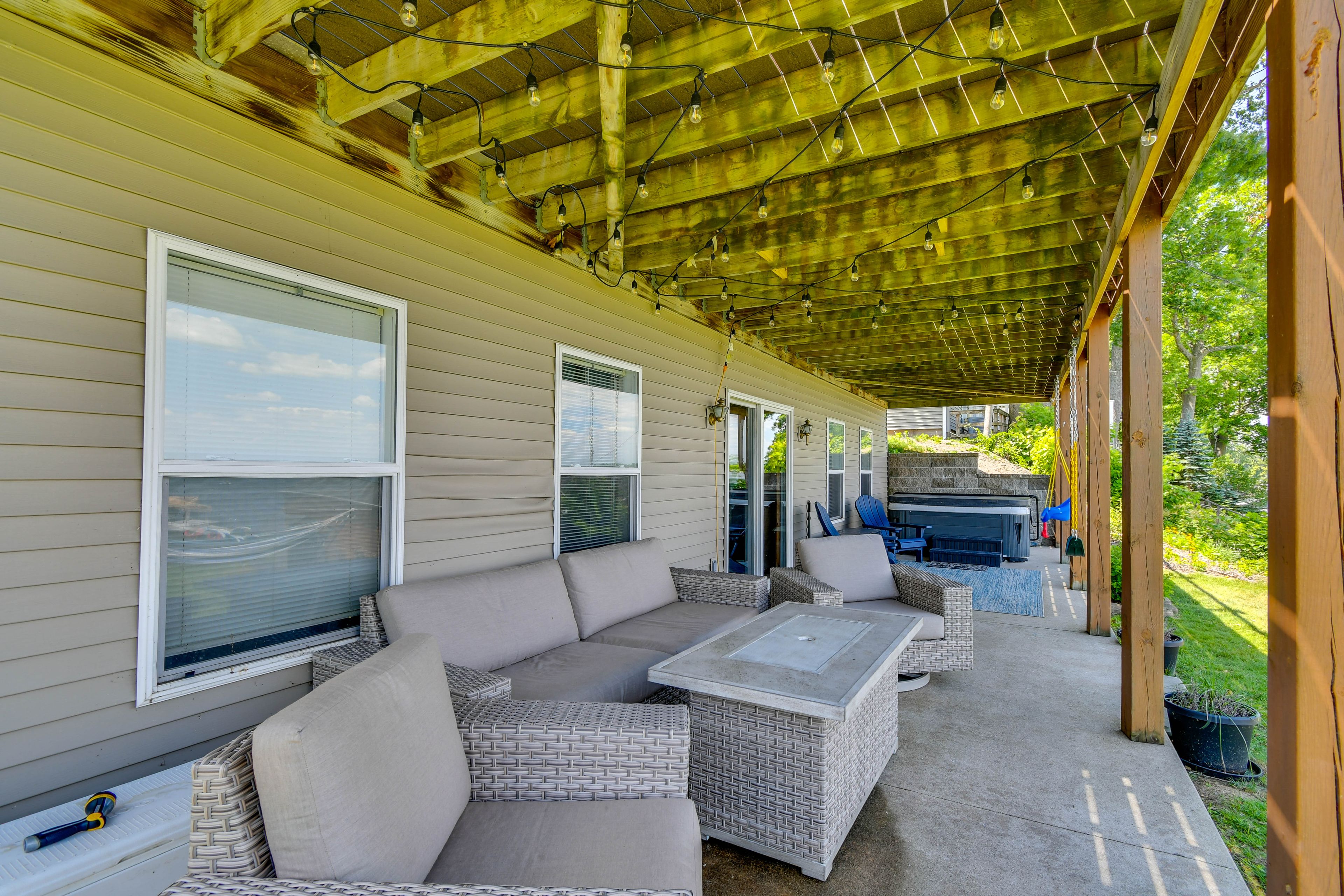 Covered Patio | Lounge Seating | Private Hot Tub | Swings
