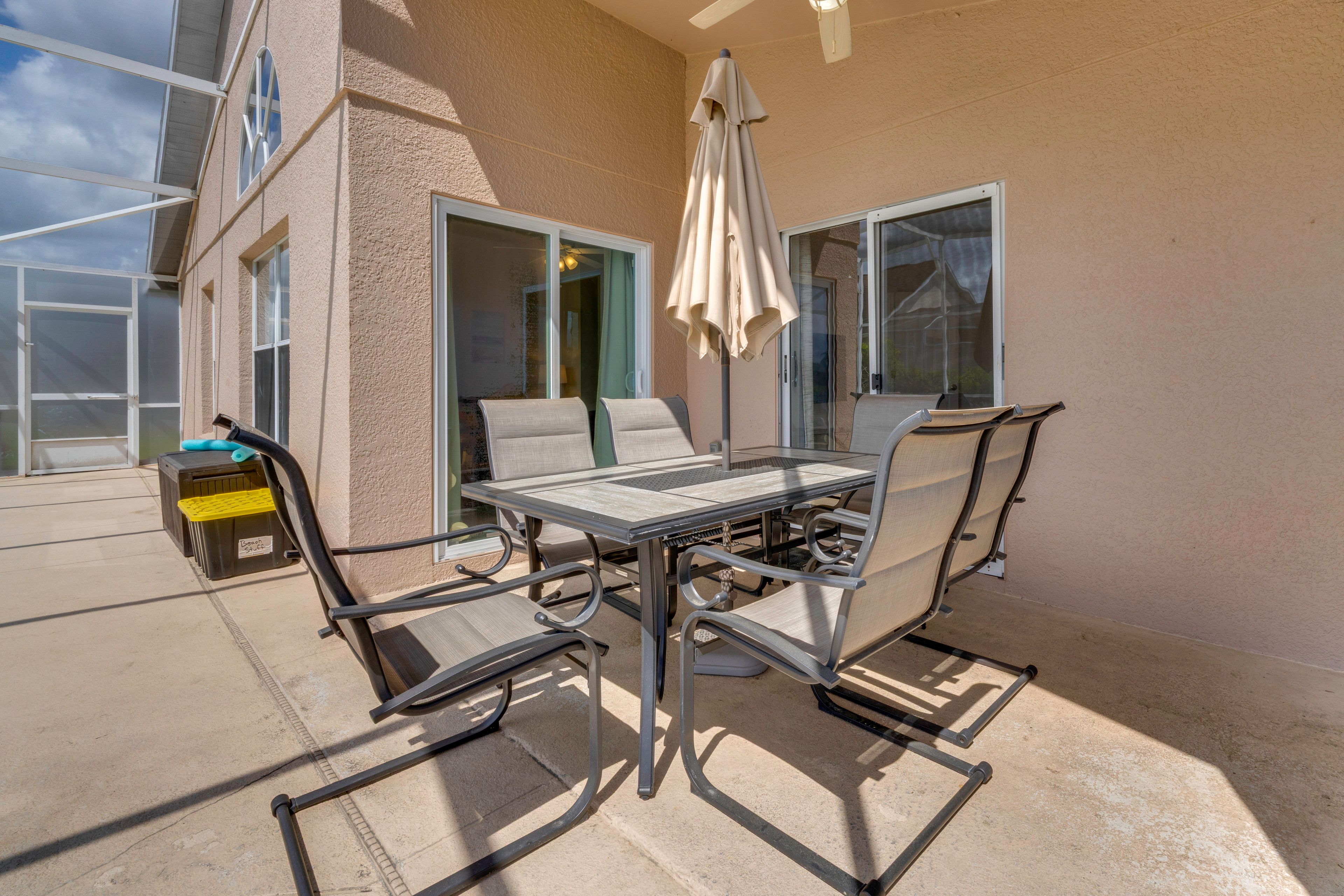 Screened-In Lanai | Gas Grill | Dining Table | Lounging Chairs