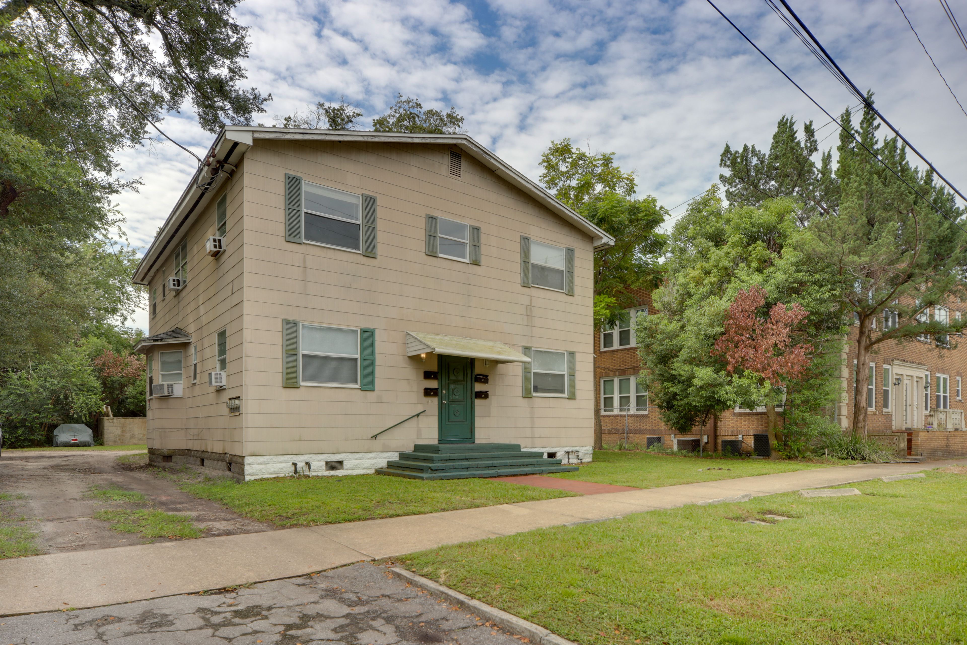 Condo Exterior | Open Lots (2 Vehicles, First-Come, First-Served)