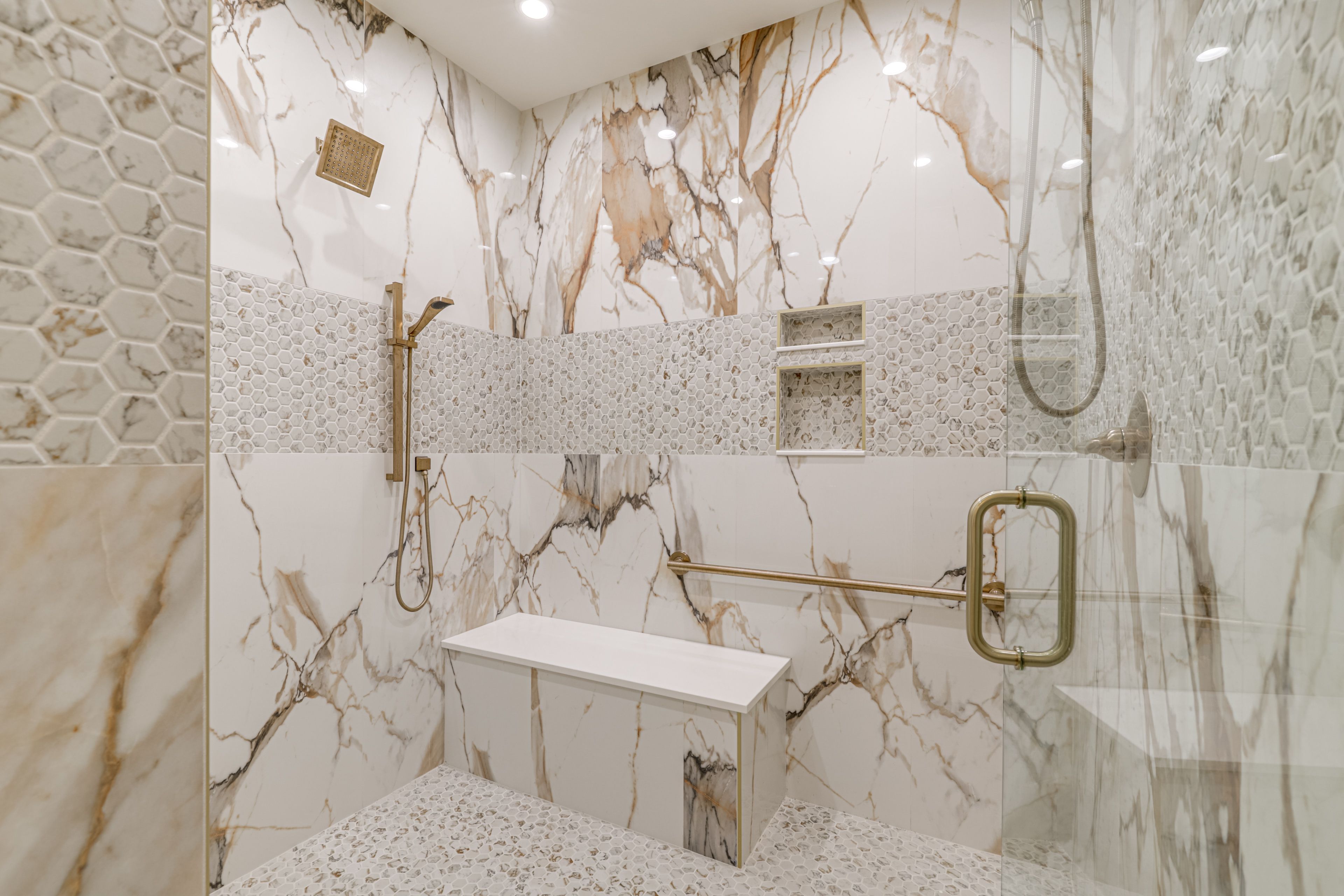 Heated floors, Bluetooth speakers, and an oversized multi-head shower