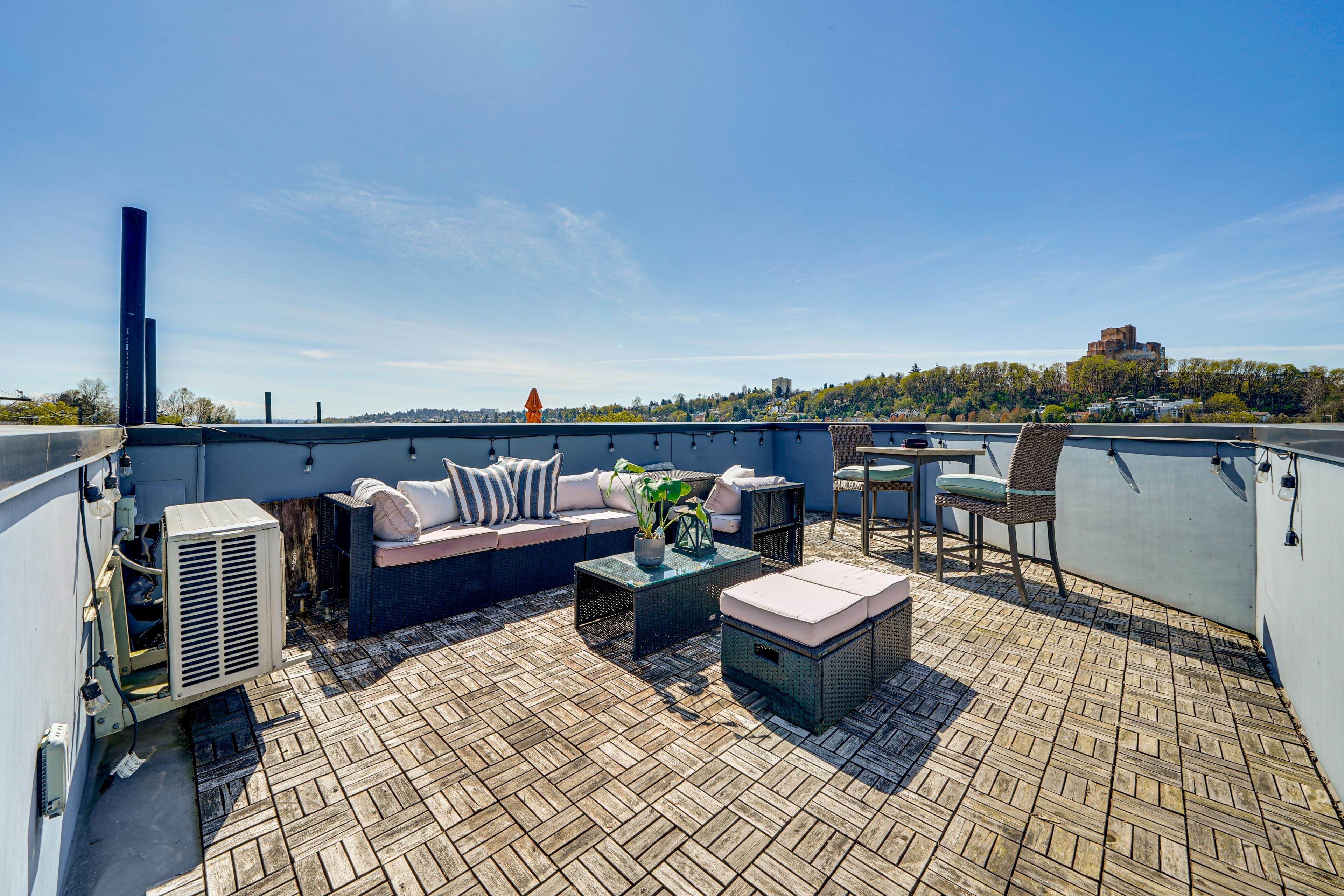 Rooftop Patio | Dining & Lounge Areas | City Skyline Views