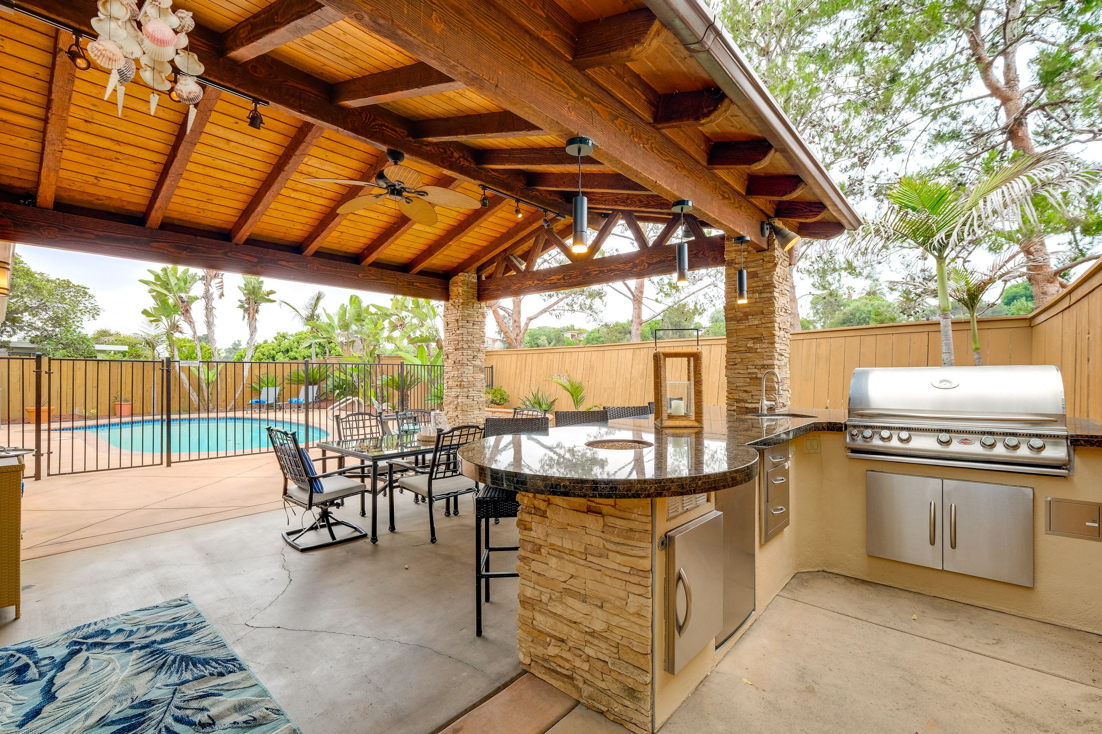 Dining Area | Wet Bar | Kitchen w/ Fridge & Gas Grill