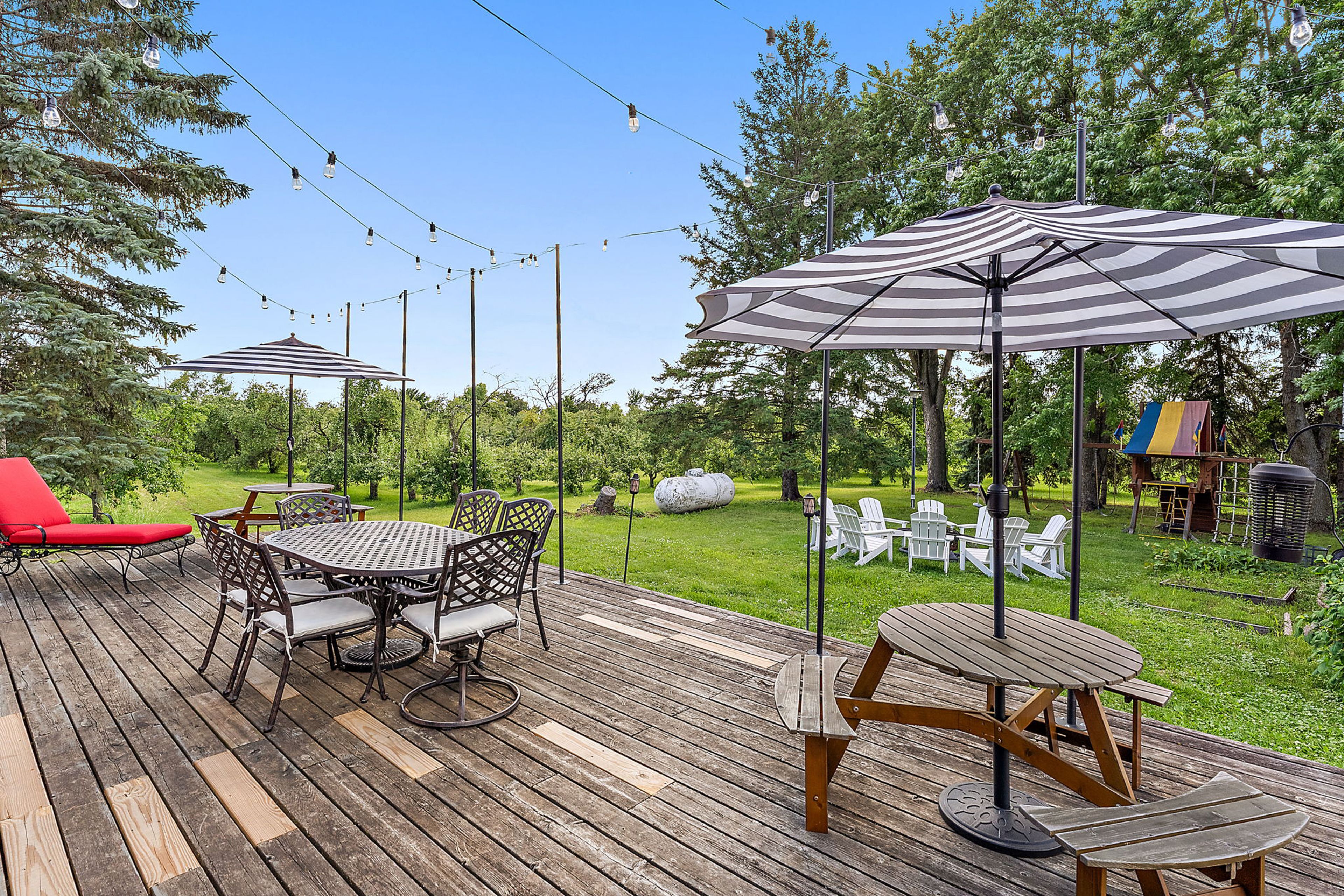 Furnished Deck | Dining Tables | Fire Pit | Swing Set