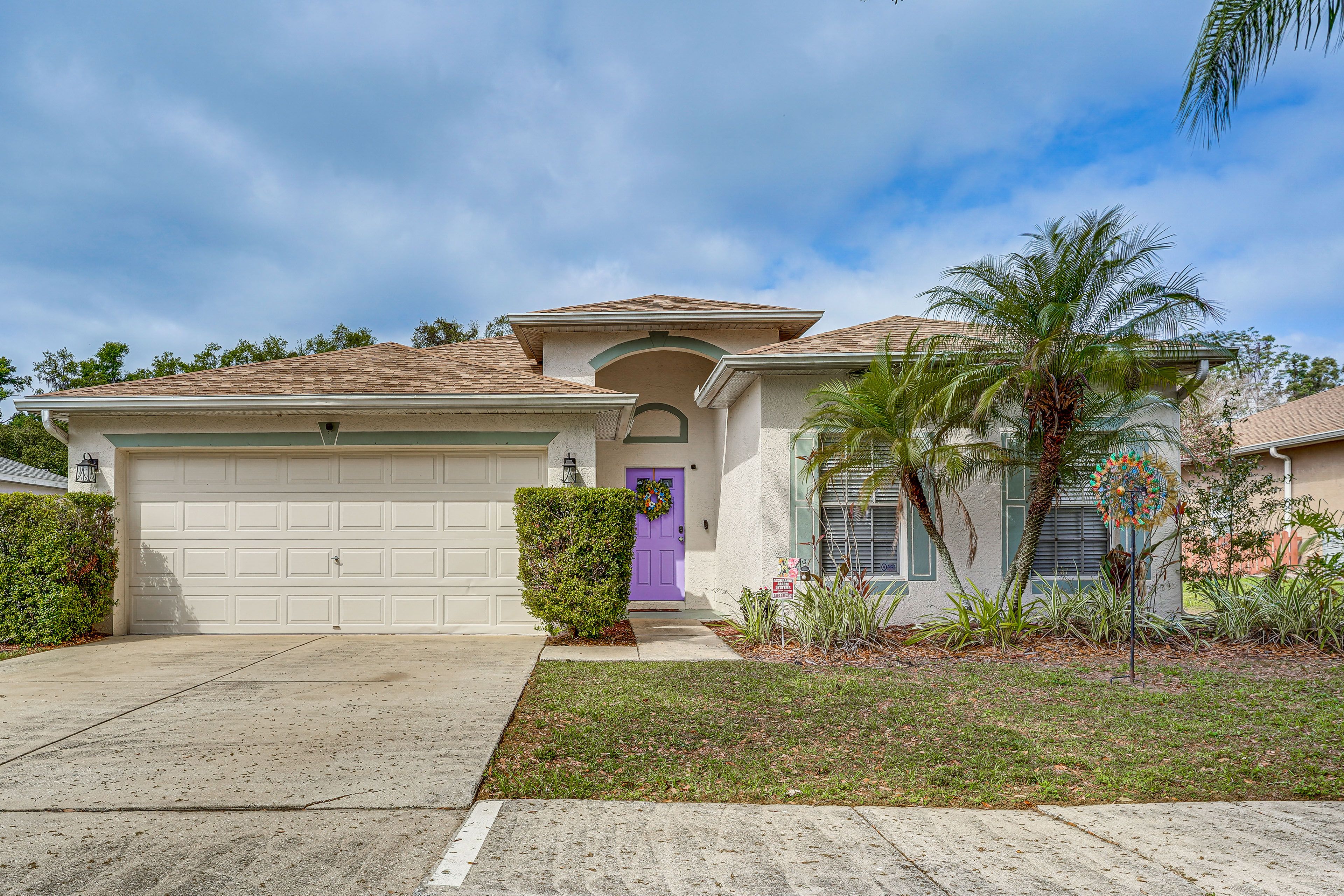 Property Exterior | Screened-In Lanai | Spacious Yard