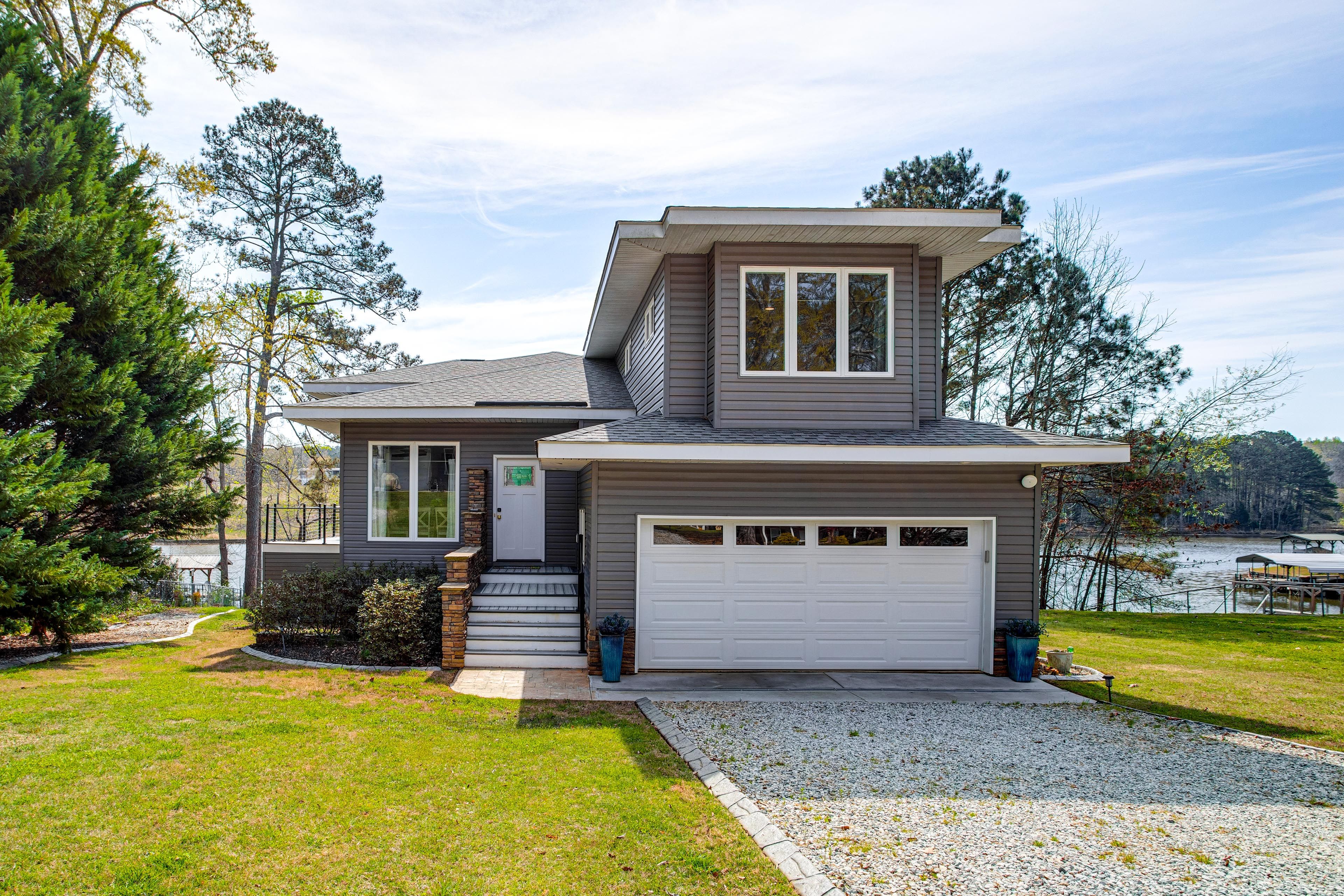 Property Exterior | Deck + Patio w/ Seating | Outdoor Kitchen | Spacious Yard