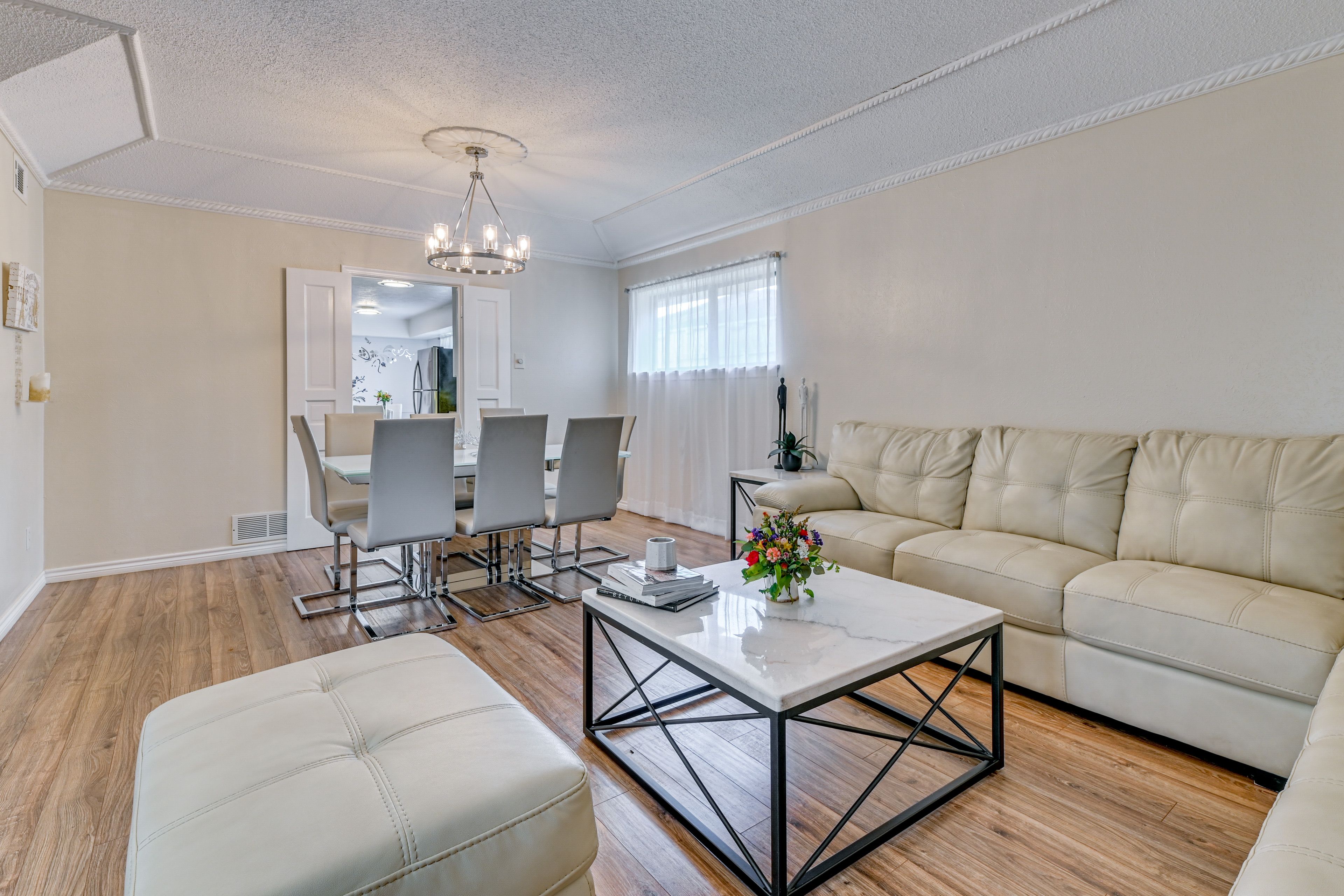 Intimate living/dining room with premium leather furnishings