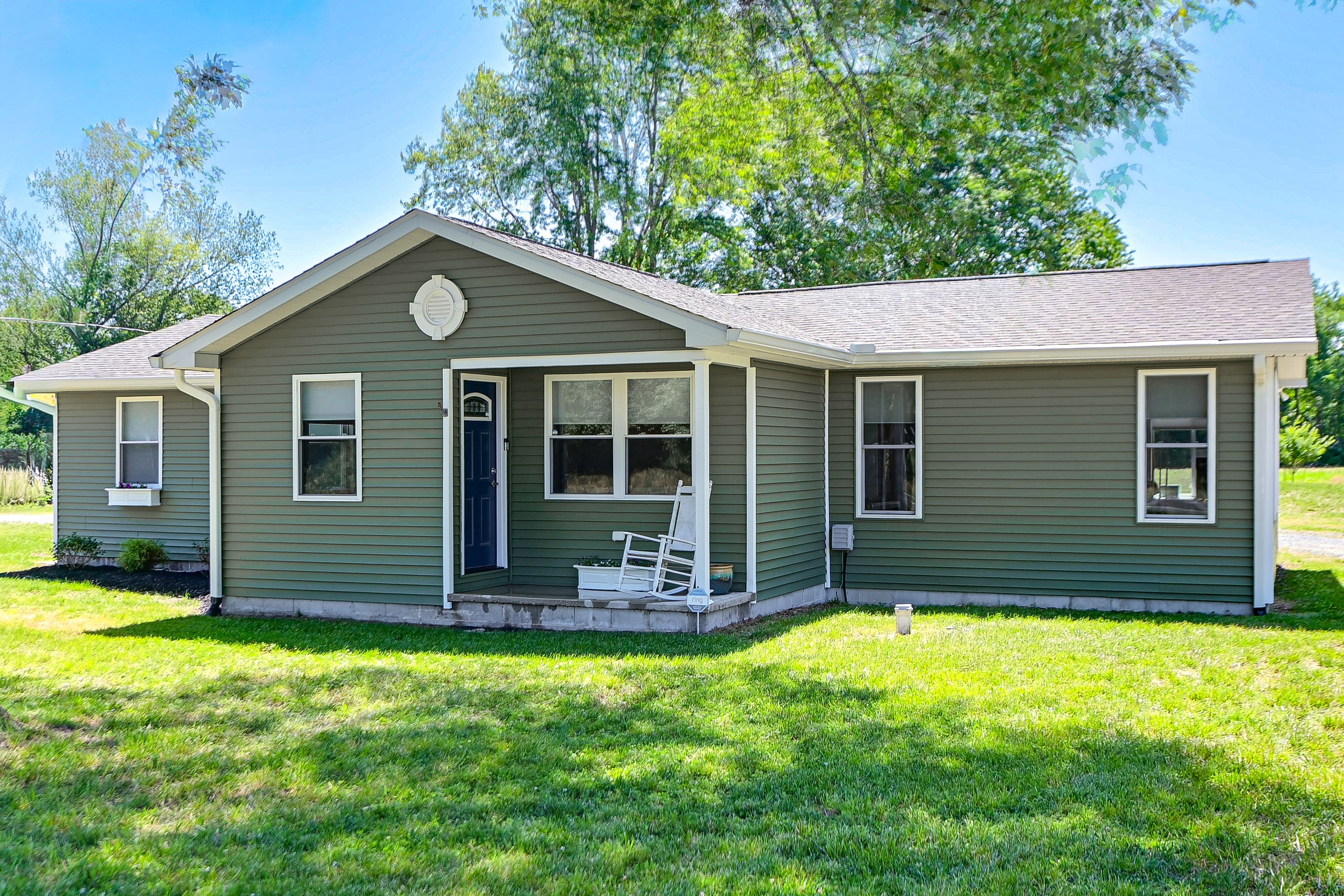 Property Exterior | Covered Porch | Spacious Yard