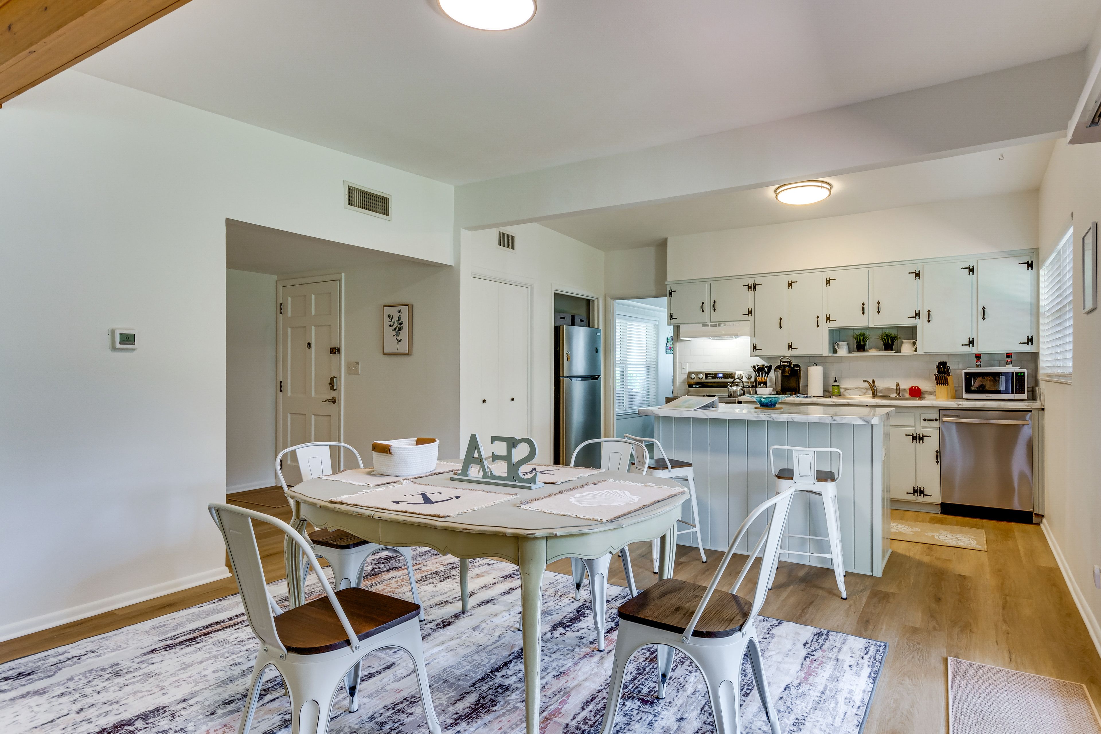 Dining & Kitchen Area | Open Interior | Central Heating & A/C