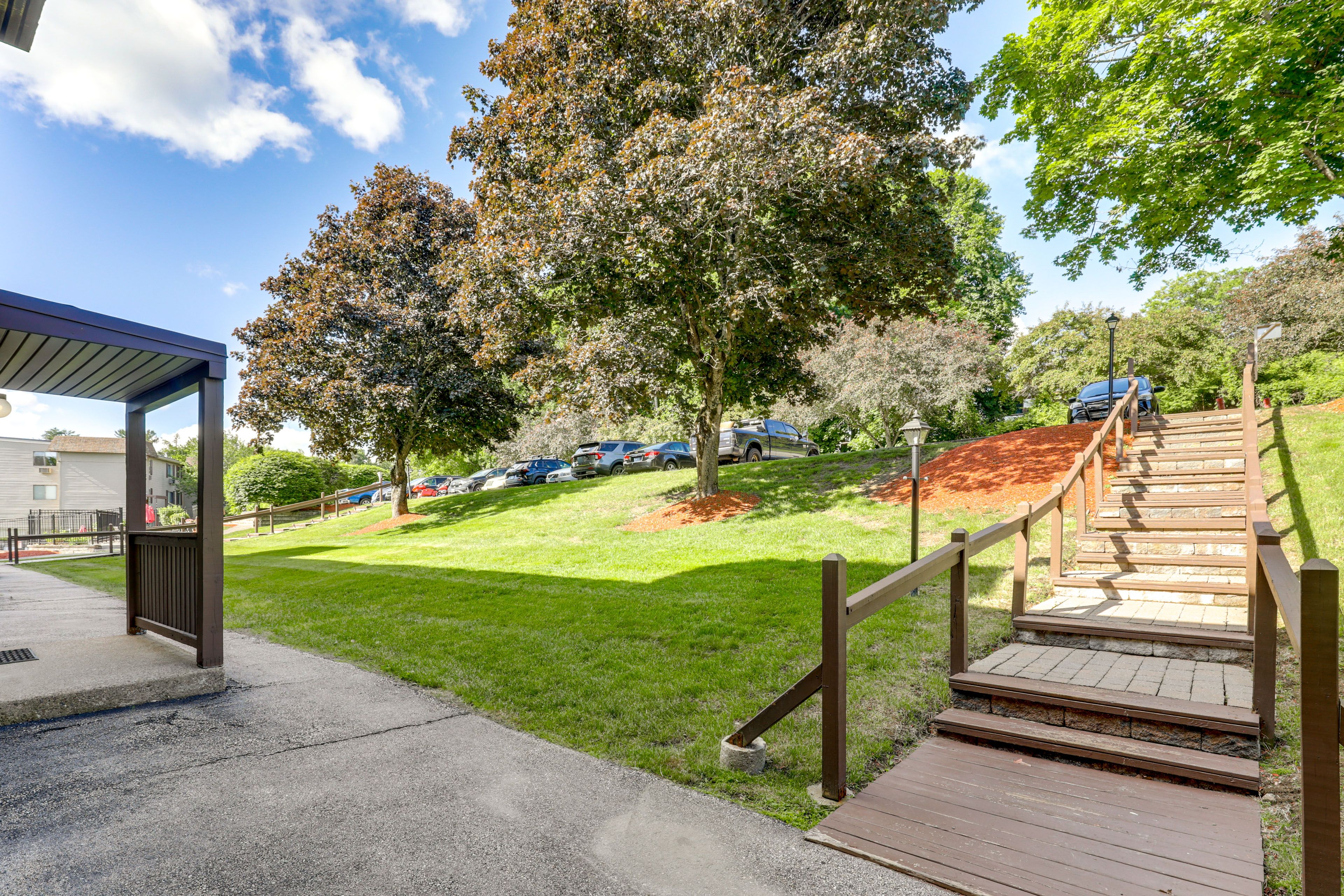 Condo Exterior | Open Parking Lot (First-Come, First-Served)