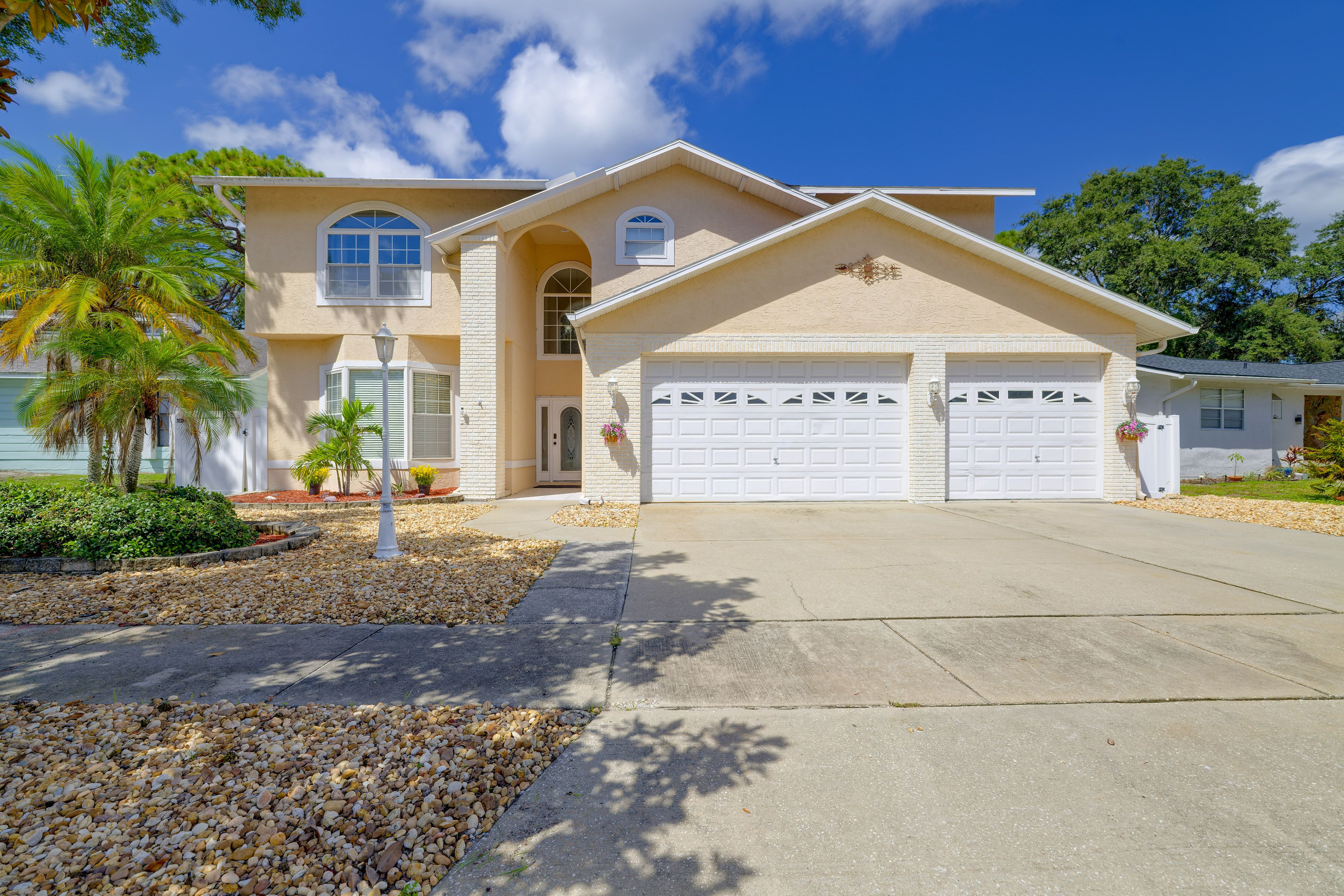Property Exterior | Patio w/ Bar Area | Outdoor Dining Area